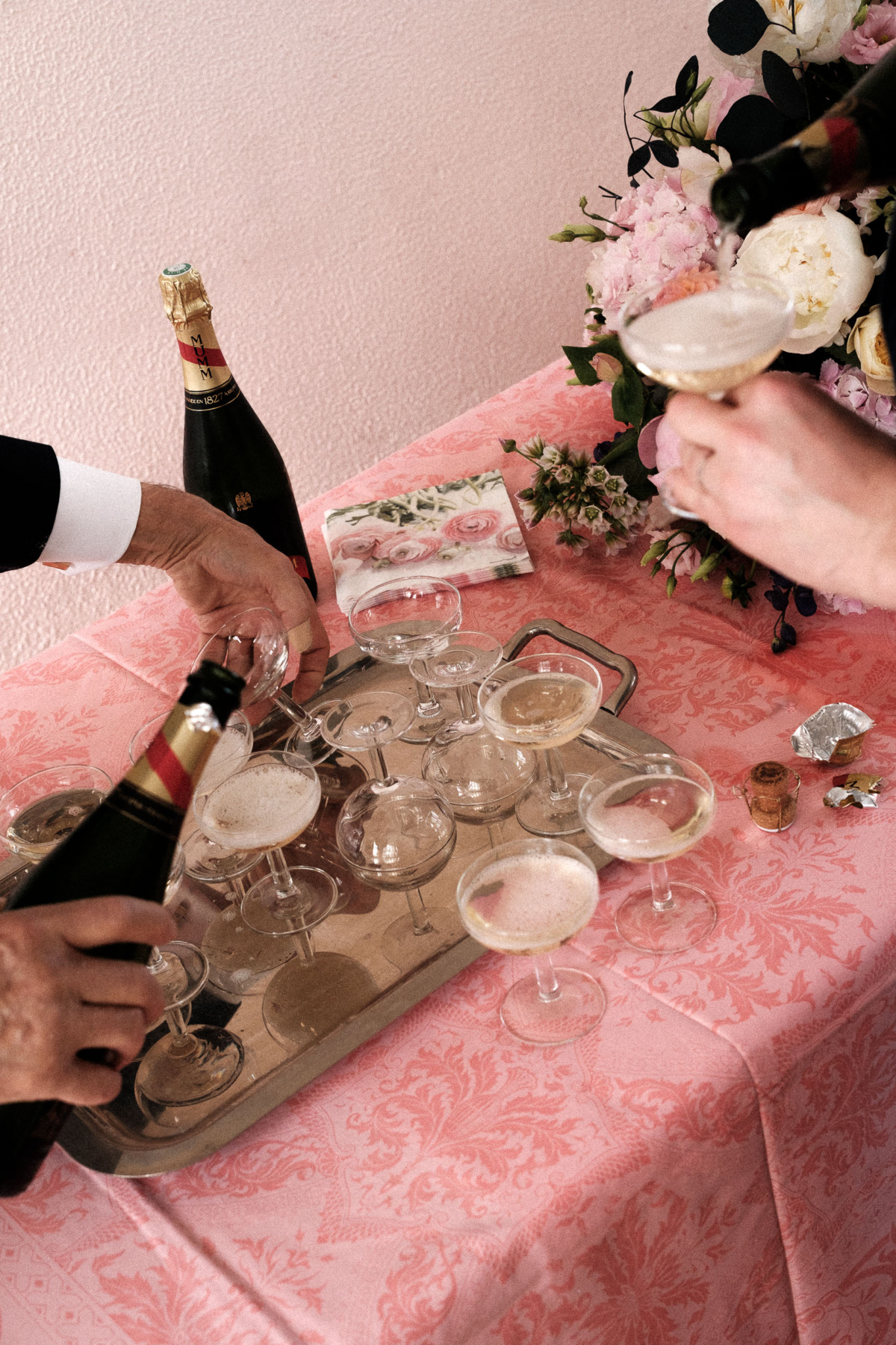 Celebrating with champagne after the ceremony – a classic French touch at this beautifully intimate wedding in Manonviller. Pink toile linens and delicate coupes added a stylish, personal feel to the post-ceremony gathering.