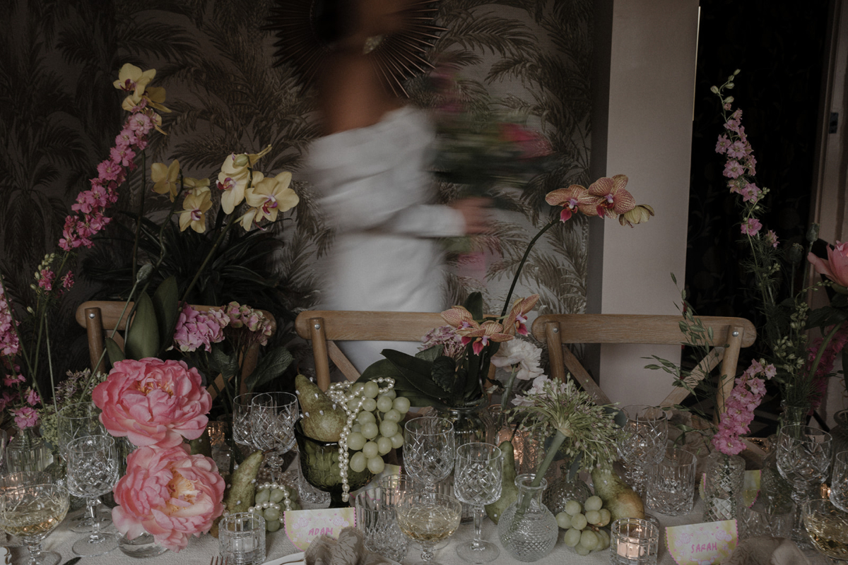 Dark, moody and romantic wedding editorial images featuring candle lit scenes and peonies. Floral styling by Luvshifting Flowers.