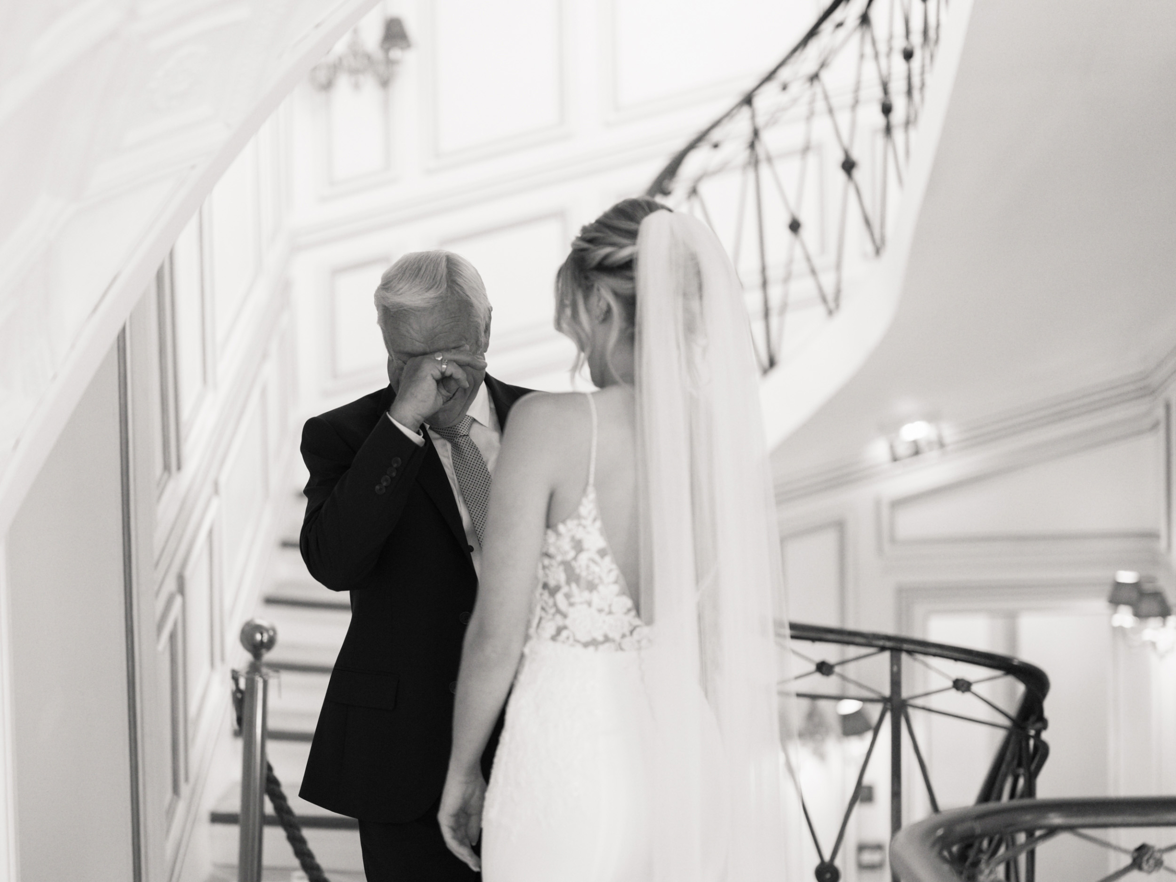 An Elegant Modern Wedding at Chateau de Robernier 60 Father of the bride wiping away tears after seeing his daughter in her wedding dress.