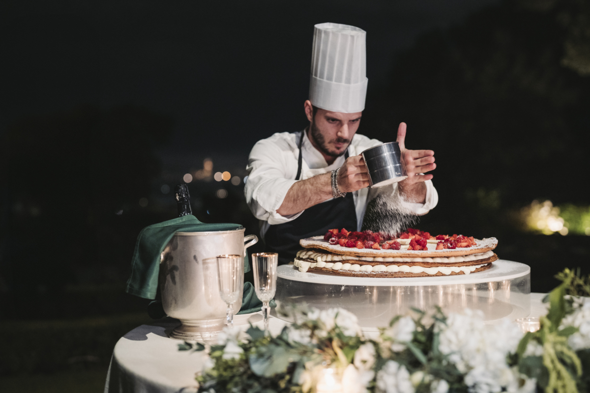 An Elegant Fusion of Indian Tradition and Italian Beauty 92 Italian chef making a traditional Italian millefeuille live during. a wedding.