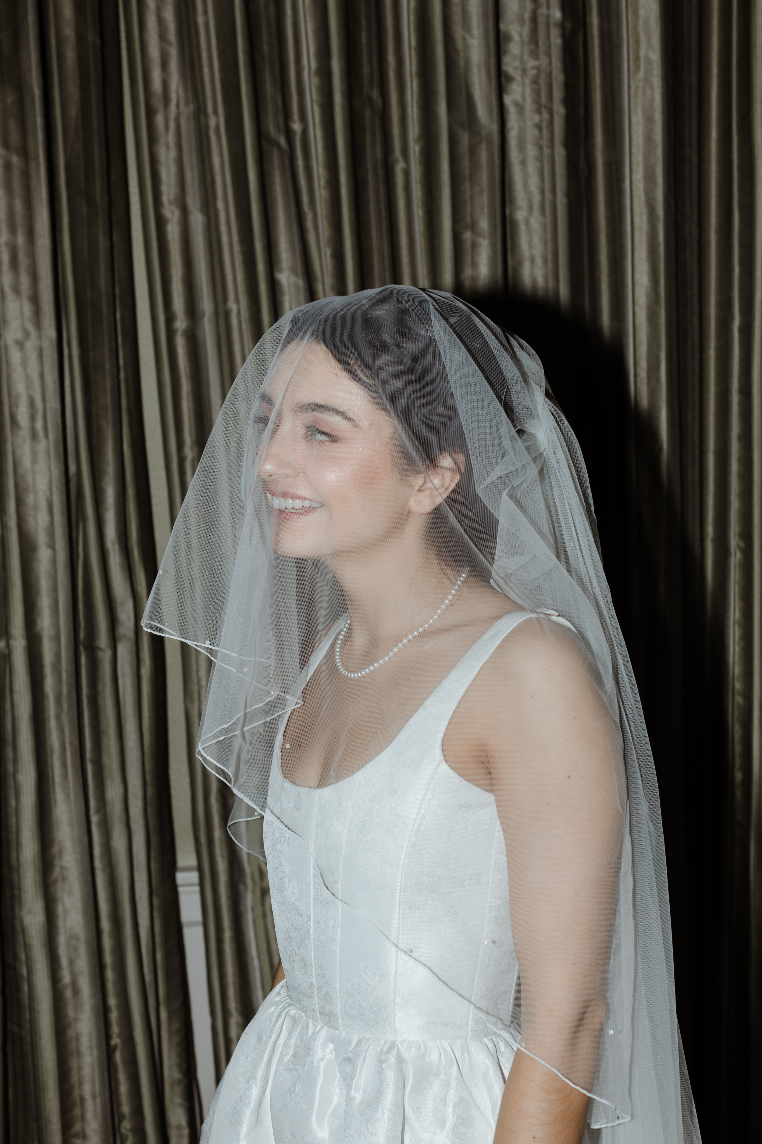 Savannah Miller Elegance for a Joyful Autumn Wedding at Drumtochty Castle 88 Bride in a mini wedding dress by V Chapman with a long wedding veil.