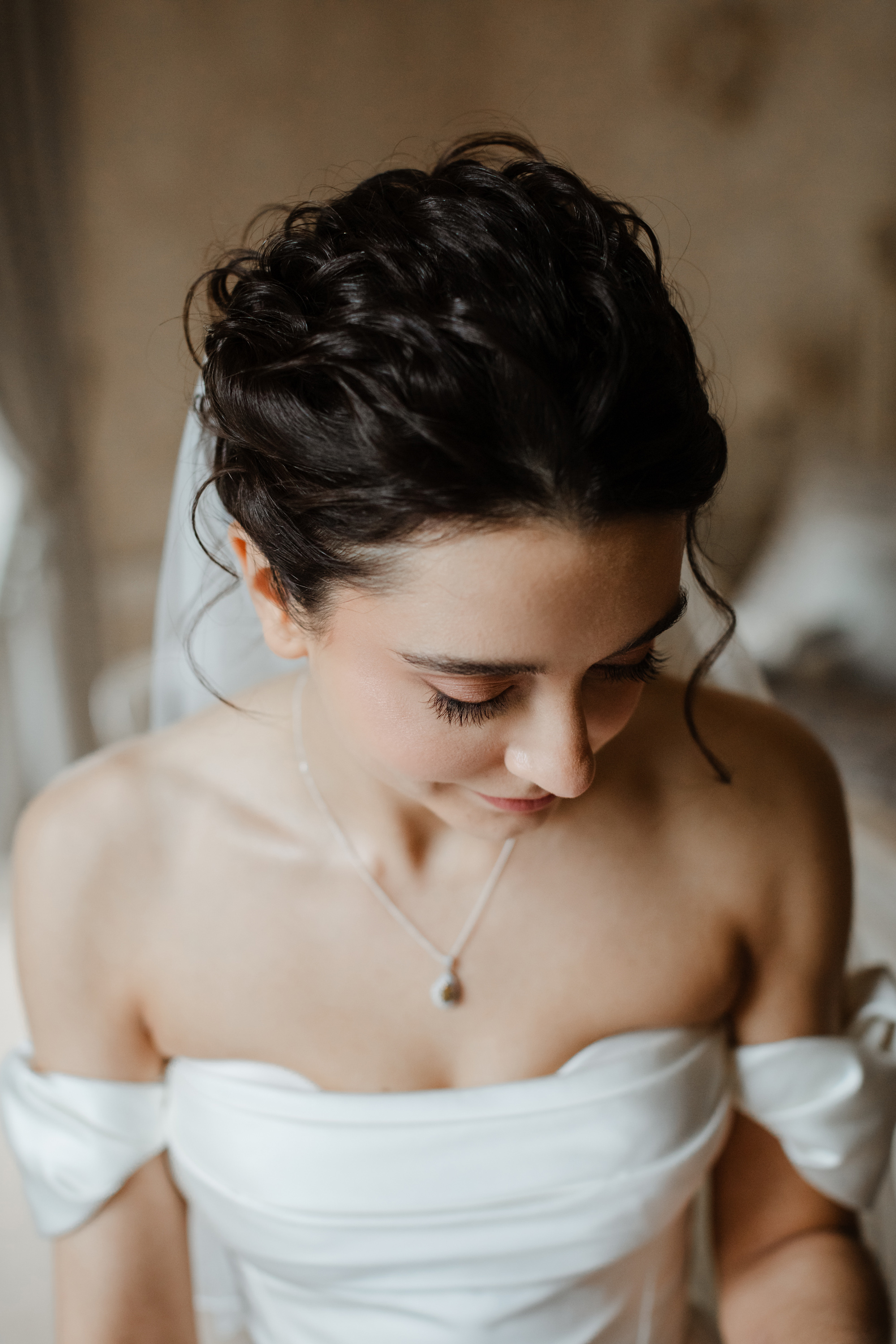 Savannah Miller Elegance for a Joyful Autumn Wedding at Drumtochty Castle 69 Close up shot of bride with an elegant up-to, focussing in on her natural wedding day makeup.
