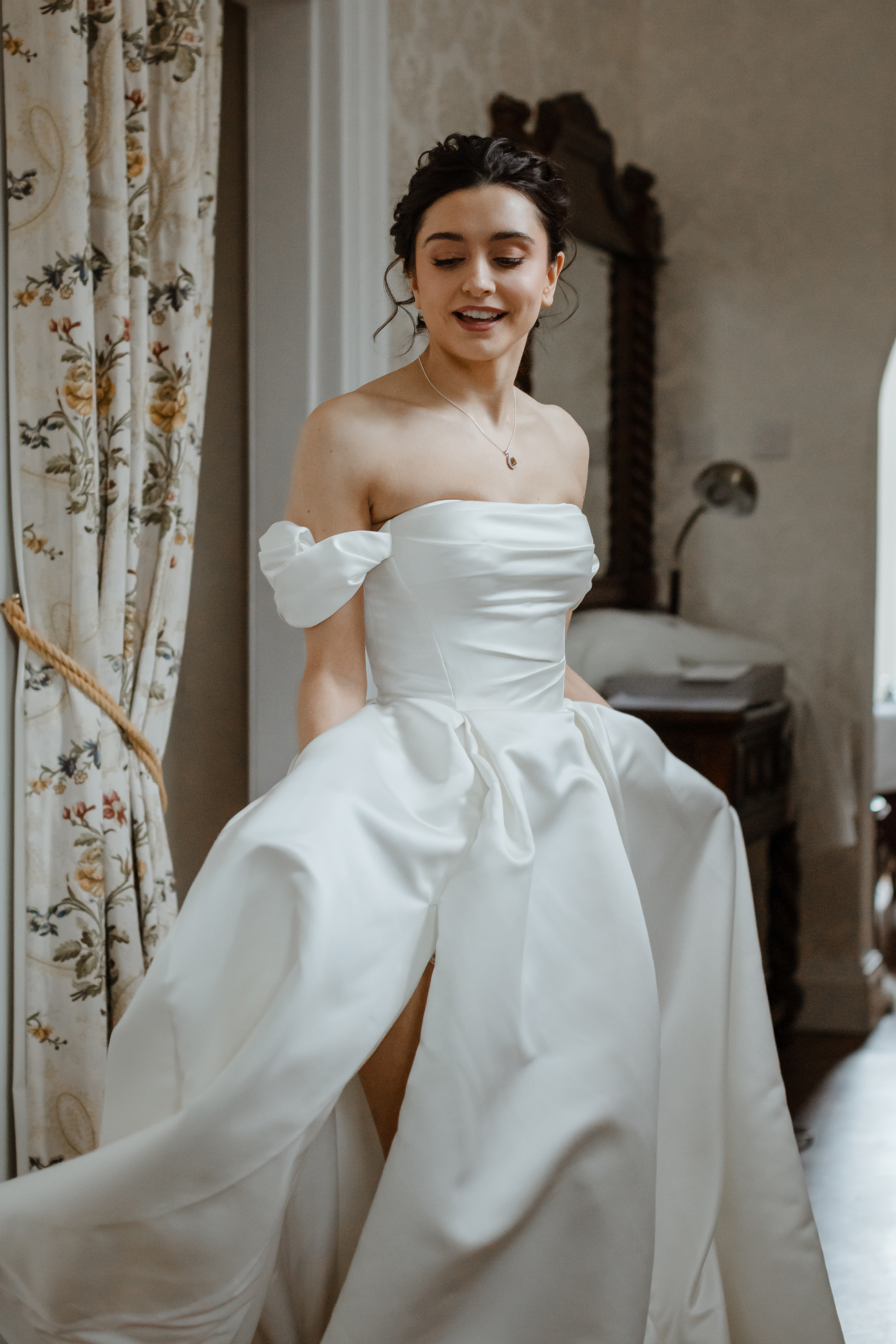 Savannah Miller Elegance for a Joyful Autumn Wedding at Drumtochty Castle 66 Bride getting ready in her Savannah Miller 'Danielle' wedding dress.