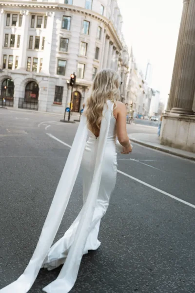 bride walking the streets of london on the way to her reception dinner
