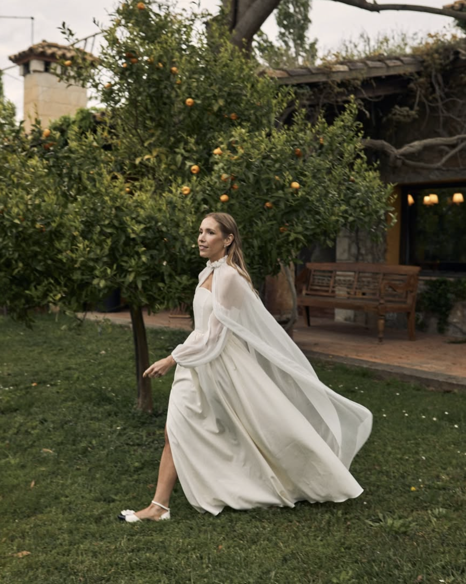 Real bride wearing a Kladek Paris silk dress and tulle veil.
