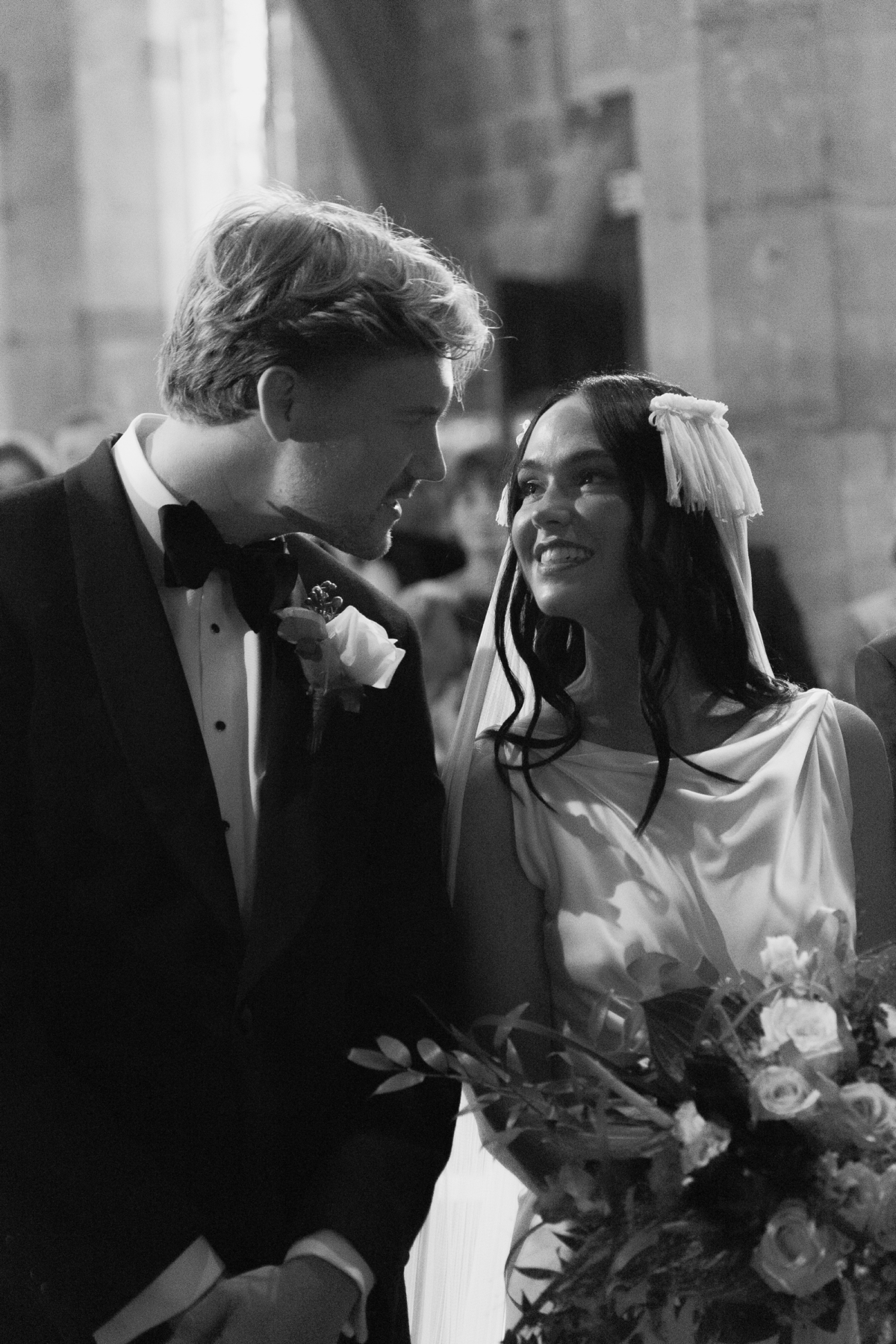 Romantic close up shot of bride and groom looking into each other's eyes during the wedding ceremony.