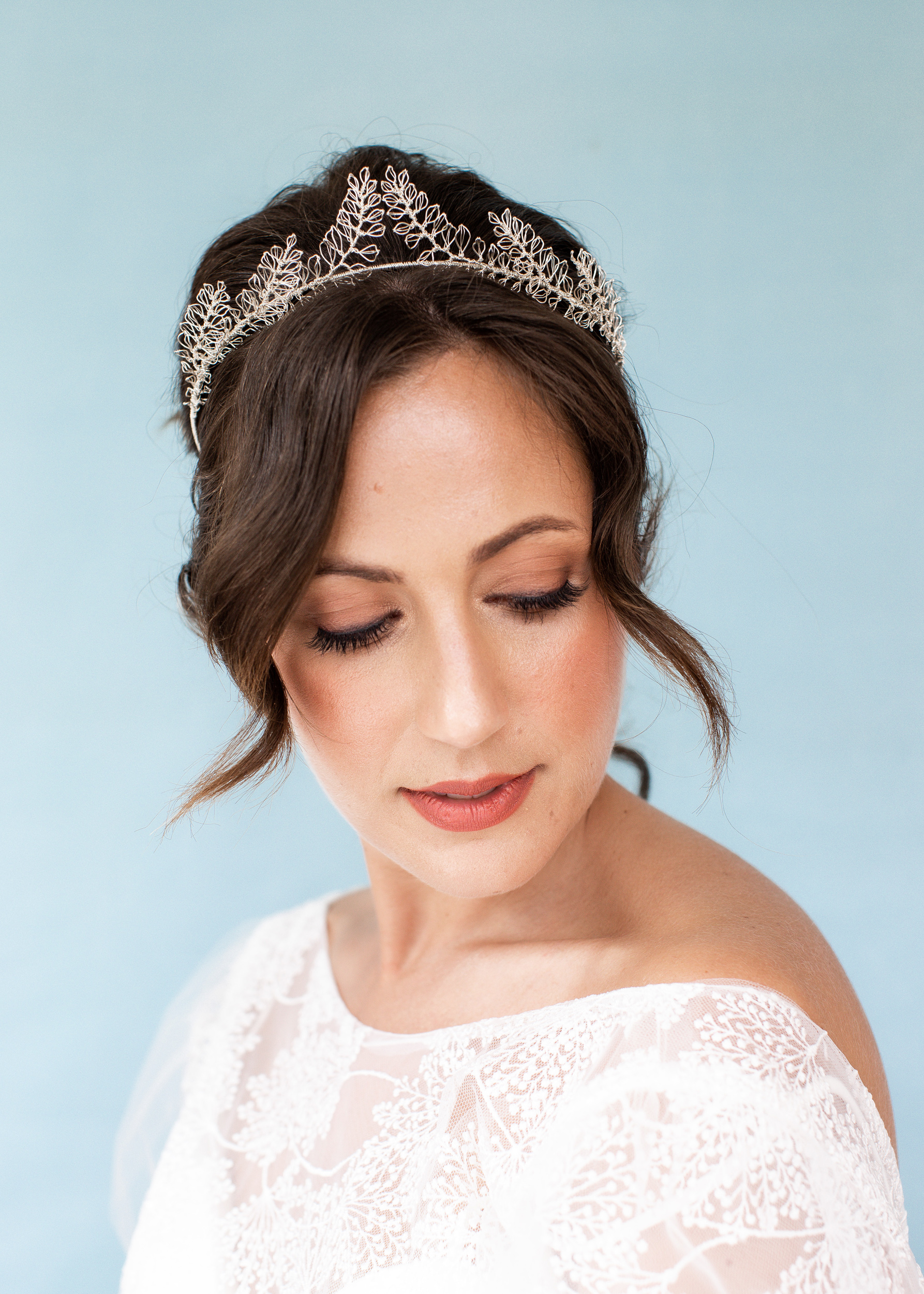 Model bride wearing a delicate and handmade silver leaf bridal headpiece by Judith Brown Bridal.