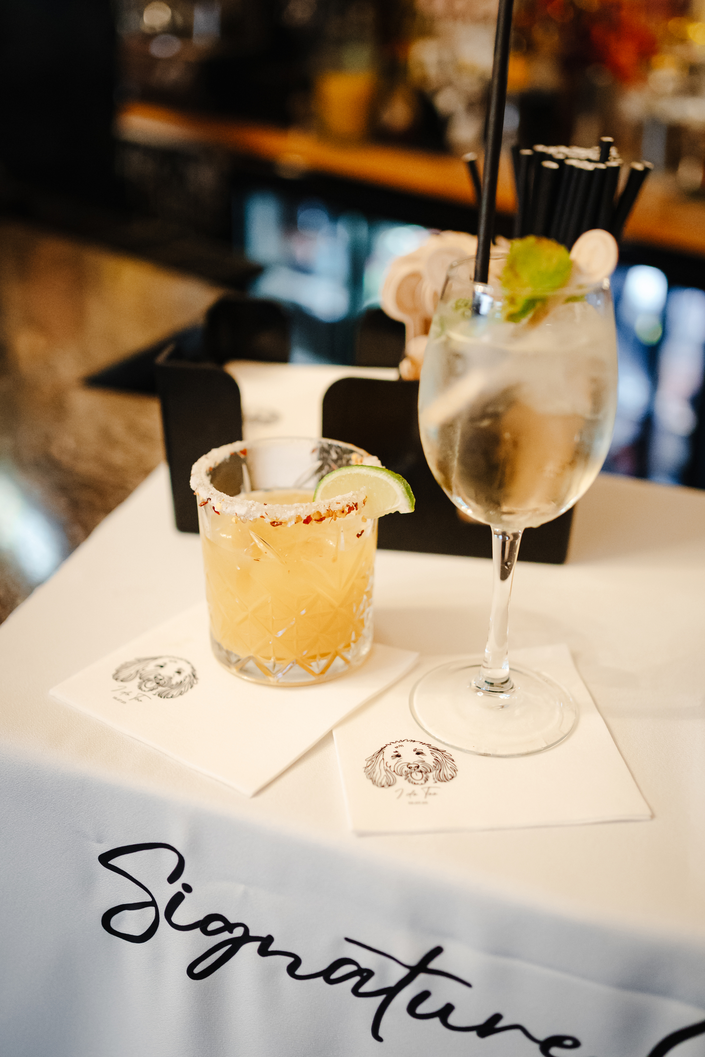 Signature is and hers cocktails at a wedding.