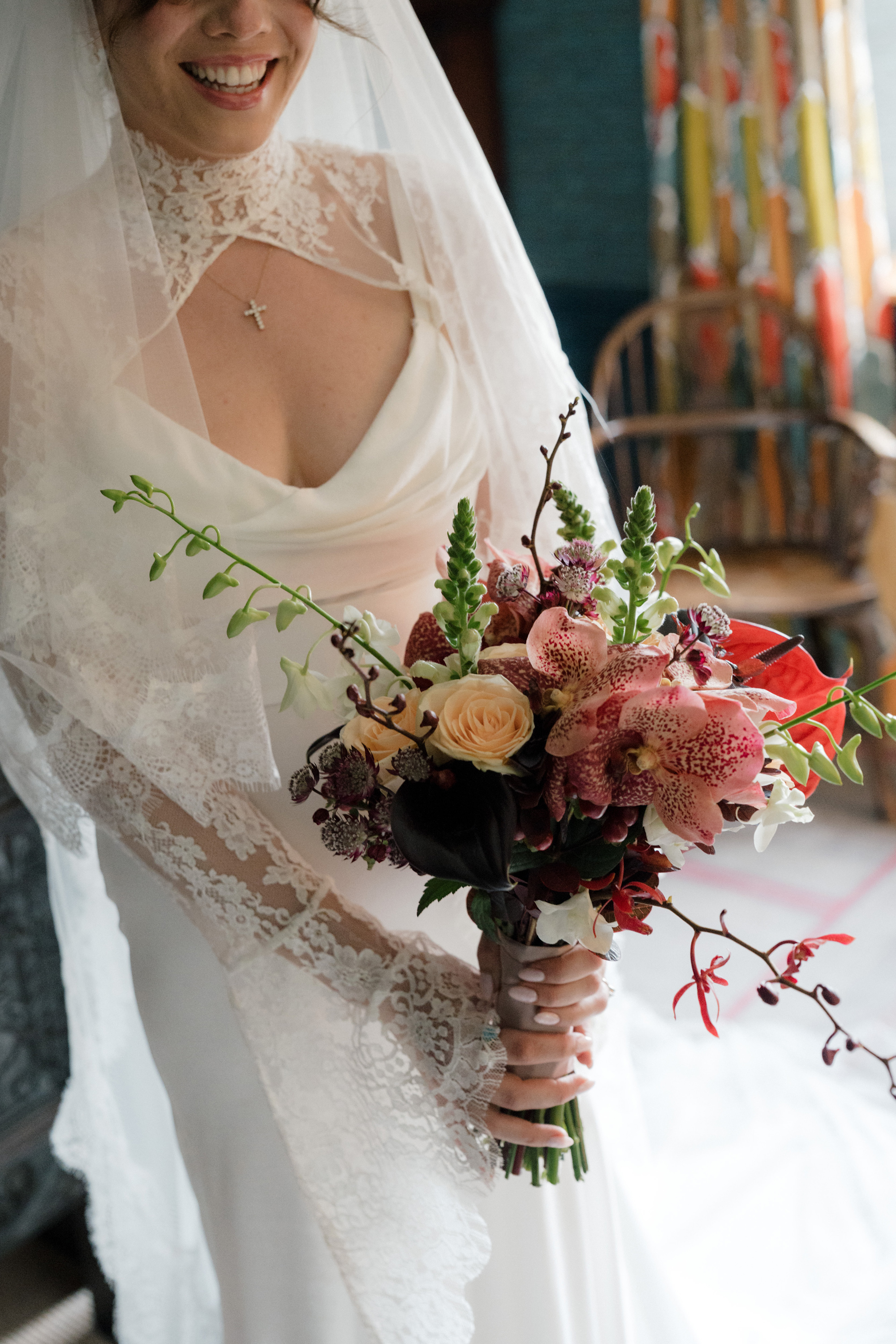 Bride getting ready in her Saint Bridal Couture dress at Gulliver's Hall, a Unique Home Stays wedding venue in The Cotswolds.