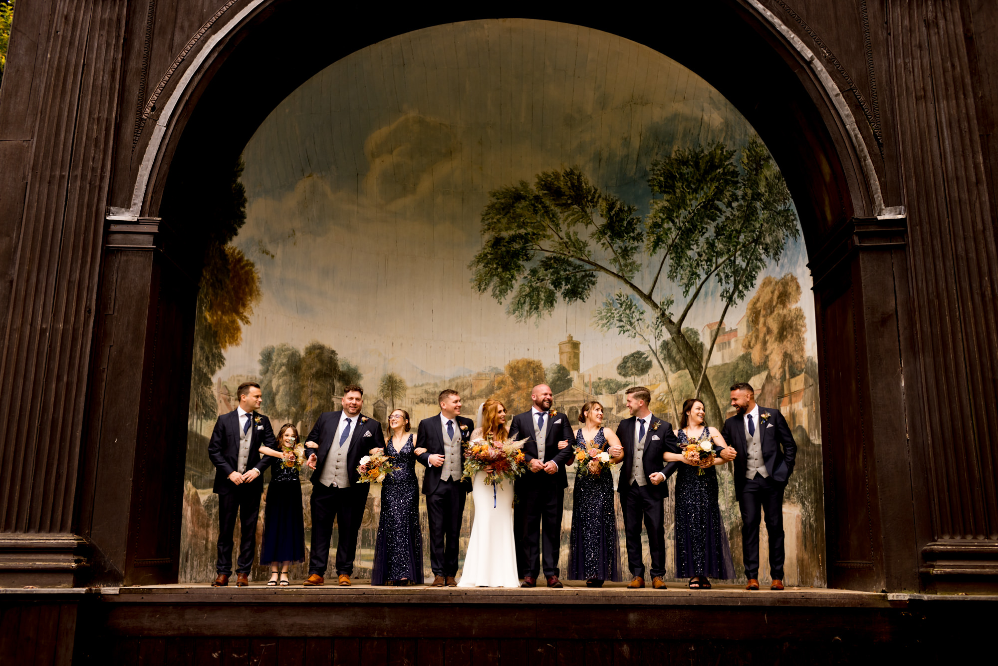 Introducing Jessica Hayman, Hampshire Wedding Photographer 24 Beautiful image of a bride and groom and their glamorous wedding party standing on a stage. Image by Hampshire wedding photographer, Jessica Hayman.