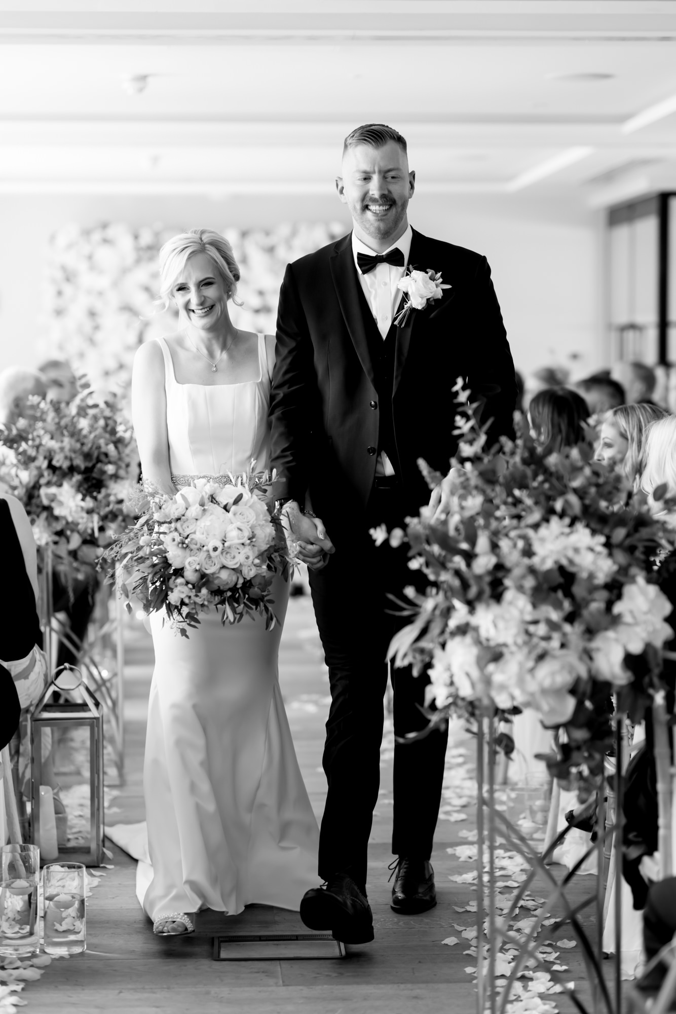 Introducing Jessica Hayman, Hampshire Wedding Photographer 3 Black and white wedding photography by Jessica Hayman of bride and groom walking back down the aisle following their wedding ceremony.