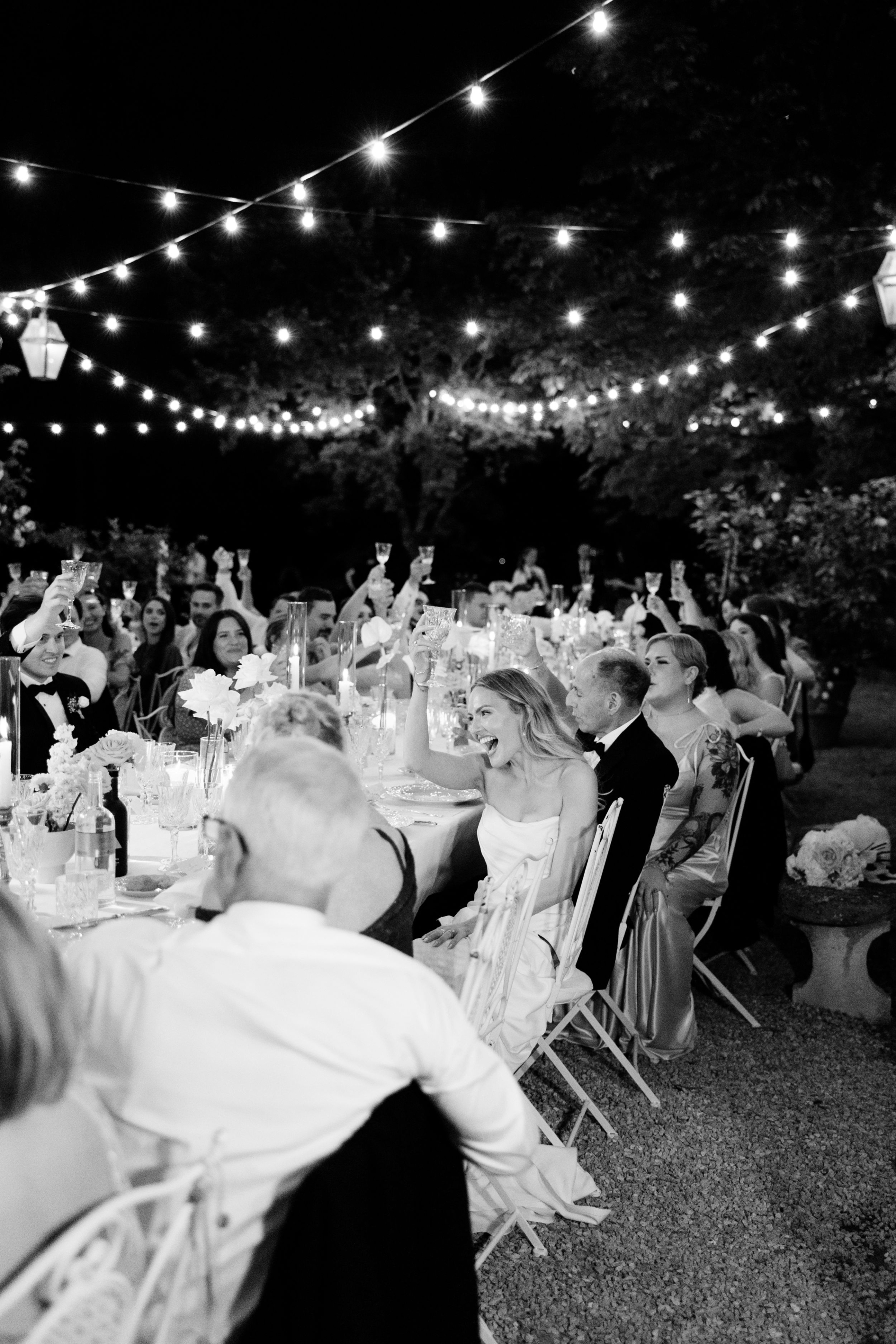 Wedding Borgo Sant Ambrogio Tuscany Italy 145 - A Modern, Romantic Destination Wedding at Borgo Sant Ambrogio in Tuscany Festoon lights hanging above the wedding reception at Borgo Sant Ambrogio in Tuscany, Italy.