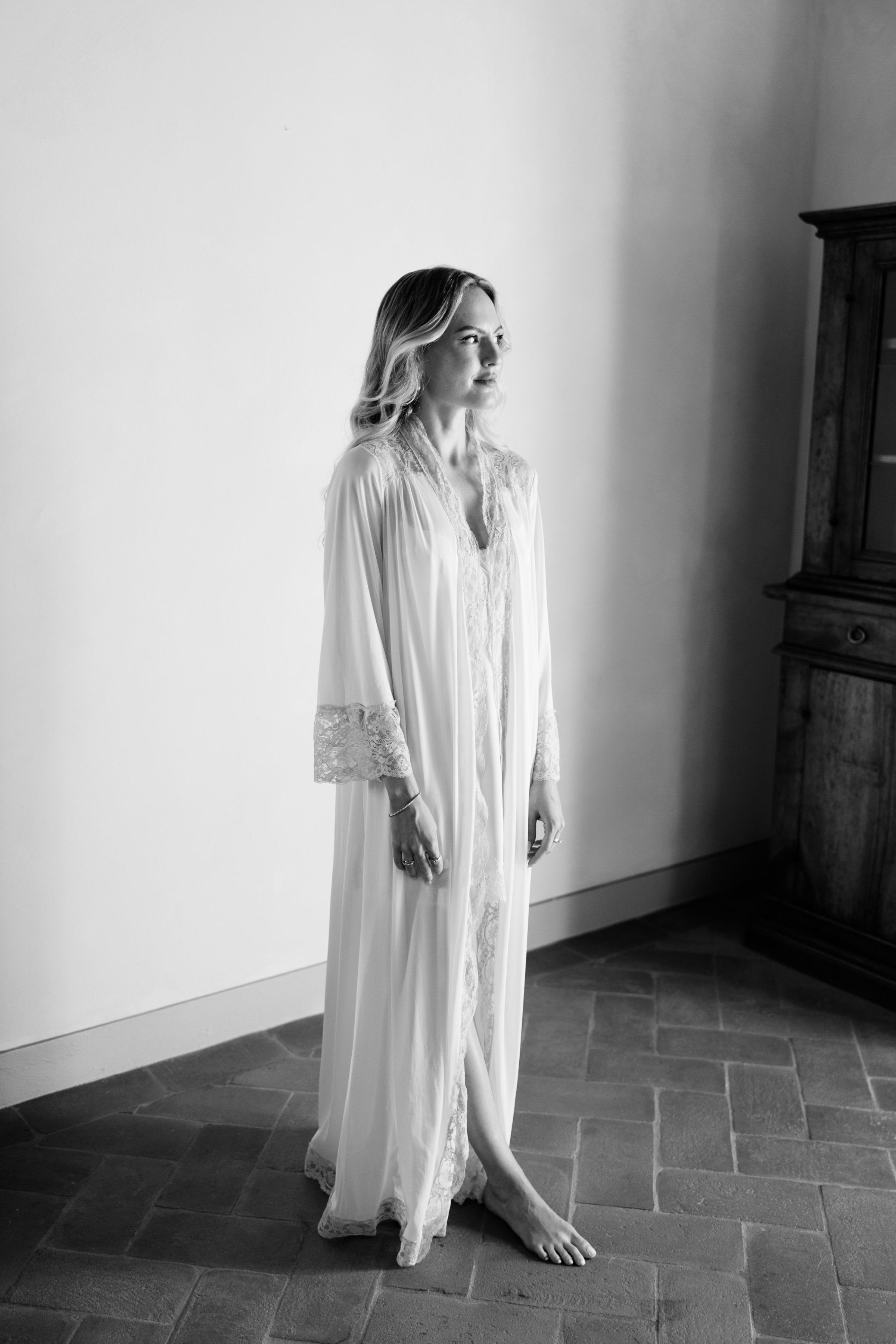 Wedding Borgo Sant Ambrogio Tuscany Italy 32 - A Modern, Romantic Destination Wedding at Borgo Sant Ambrogio in Tuscany Bride at Views from Borgo Sant Ambrogio in Tuscany getting ready in her Martina Liana dress.