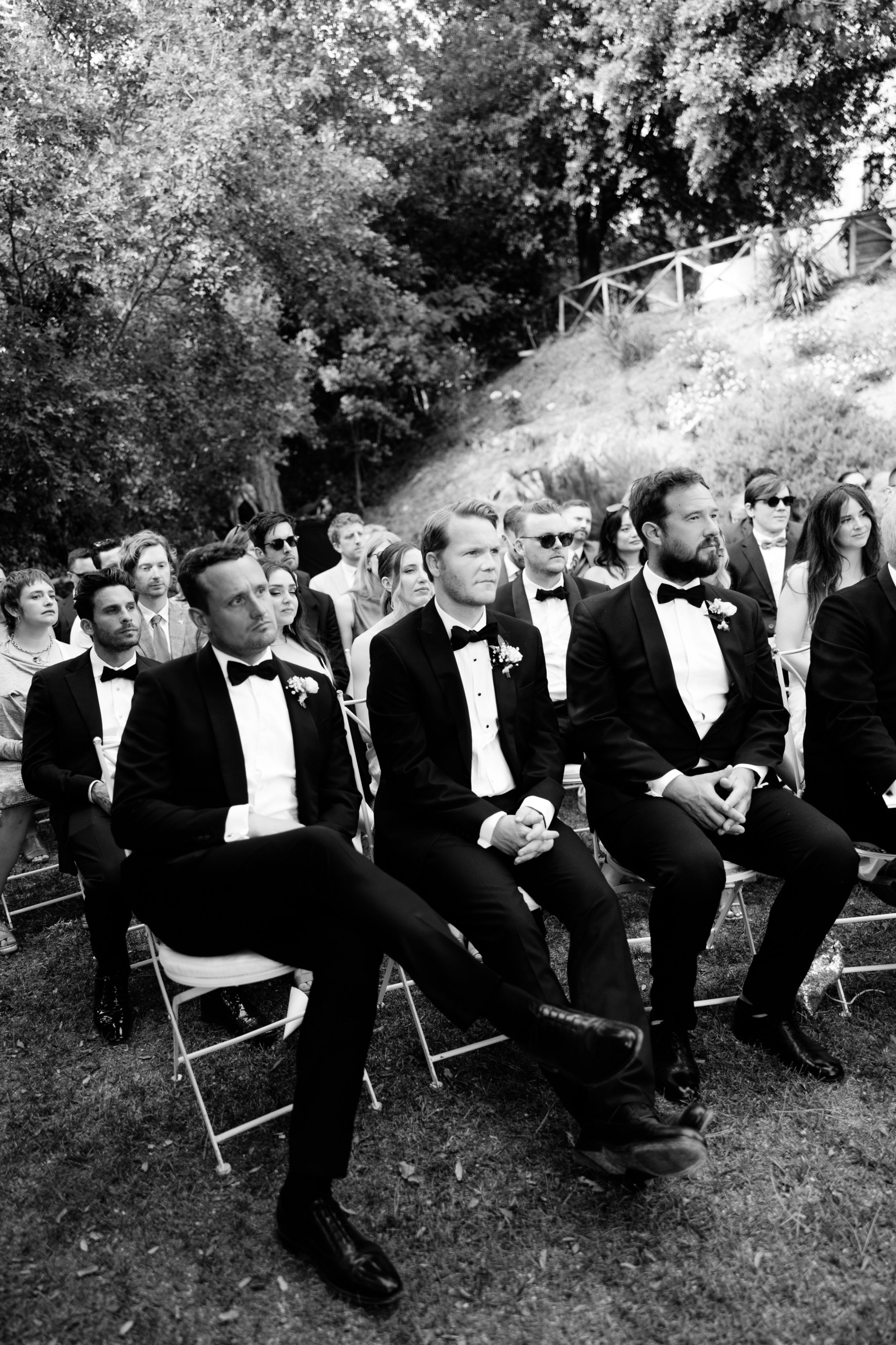 Wedding Borgo Sant Ambrogio Tuscany Italy 56 - A Modern, Romantic Destination Wedding at Borgo Sant Ambrogio in Tuscany Guests seated outdoors for a wedding at Borgo Sant Ambrogio in Tuscany, Italy.