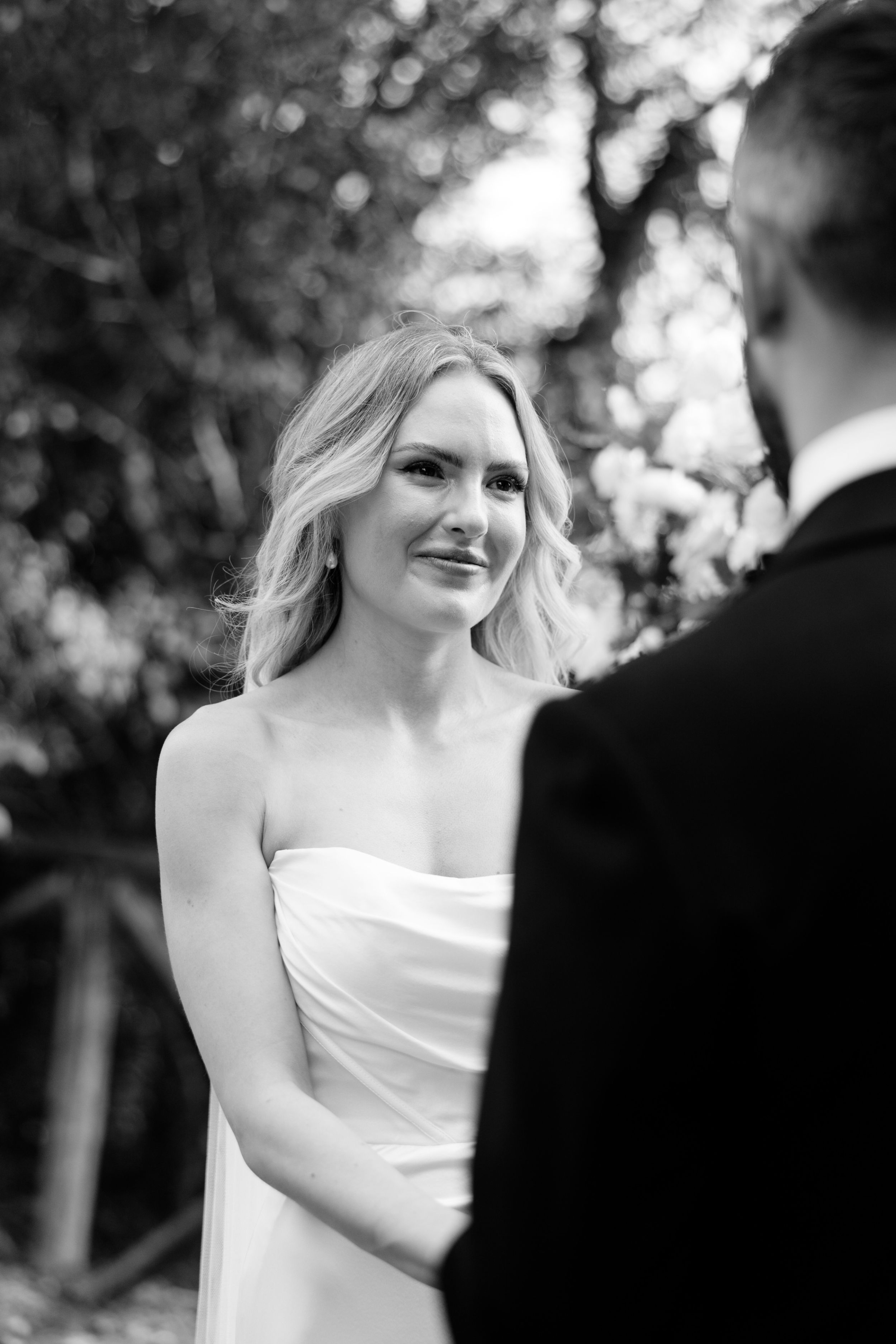 Wedding Borgo Sant Ambrogio Tuscany Italy 57 - A Modern, Romantic Destination Wedding at Borgo Sant Ambrogio in Tuscany Bride staring lovingly into the eyes of her groom during their wedding ceremony at Borgo Sant Ambrogio in Tuscany, Italy.