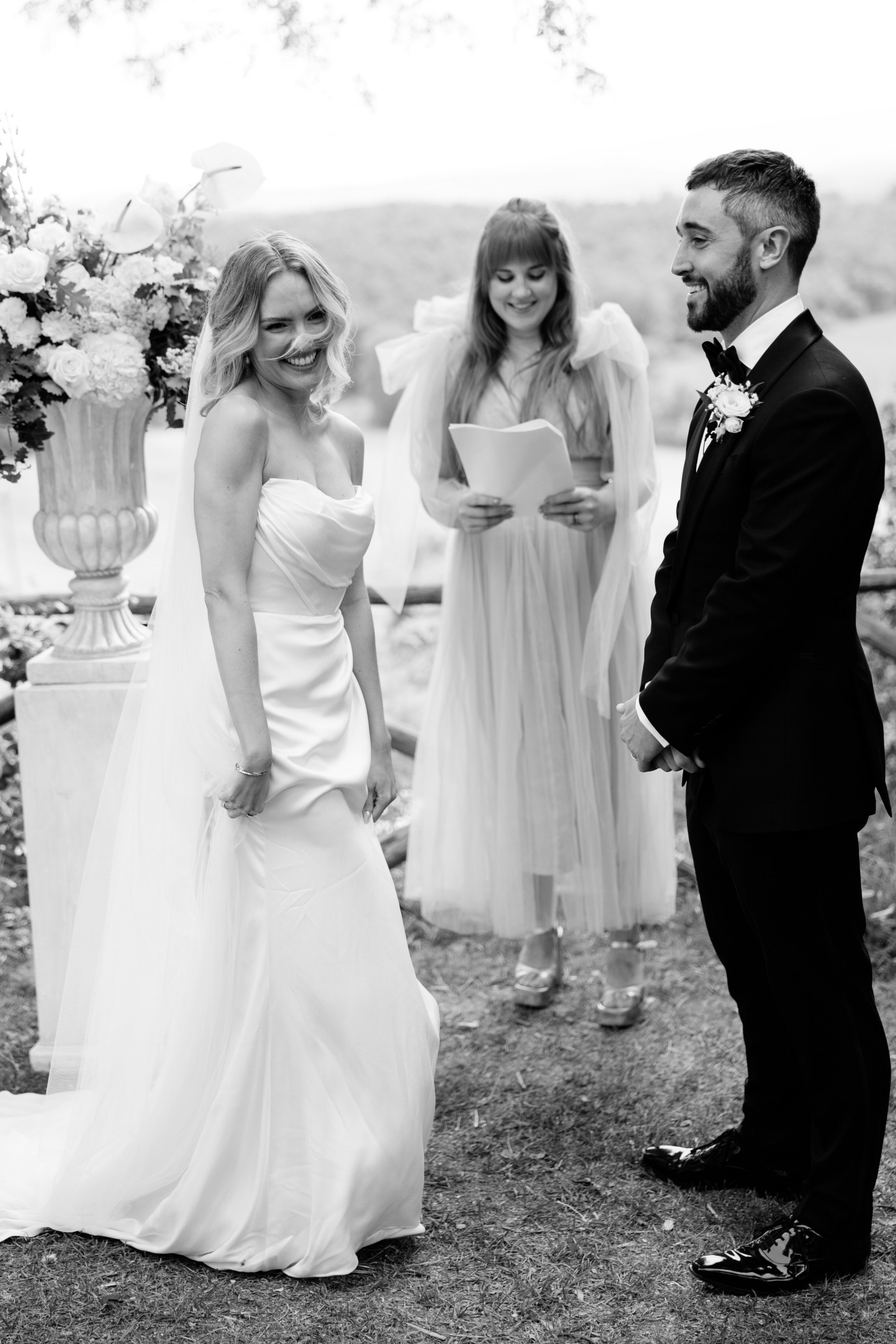 Wedding Borgo Sant Ambrogio Tuscany Italy 59 - A Modern, Romantic Destination Wedding at Borgo Sant Ambrogio in Tuscany Bride smiling in a cute way during her wedding ceremony.