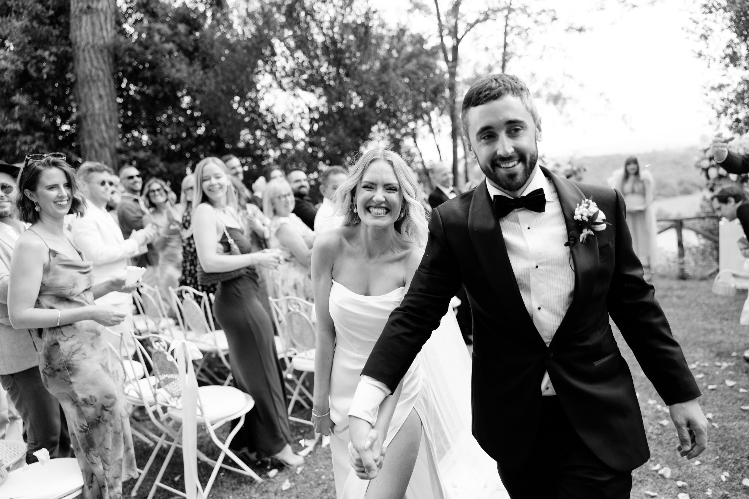 Wedding Borgo Sant Ambrogio Tuscany Italy 63 - A Modern, Romantic Destination Wedding at Borgo Sant Ambrogio in Tuscany Bride and groom walking back down the aisle after their wedding ceremony at Wedding Borgo Sant Ambrogio Tuscany Italy.