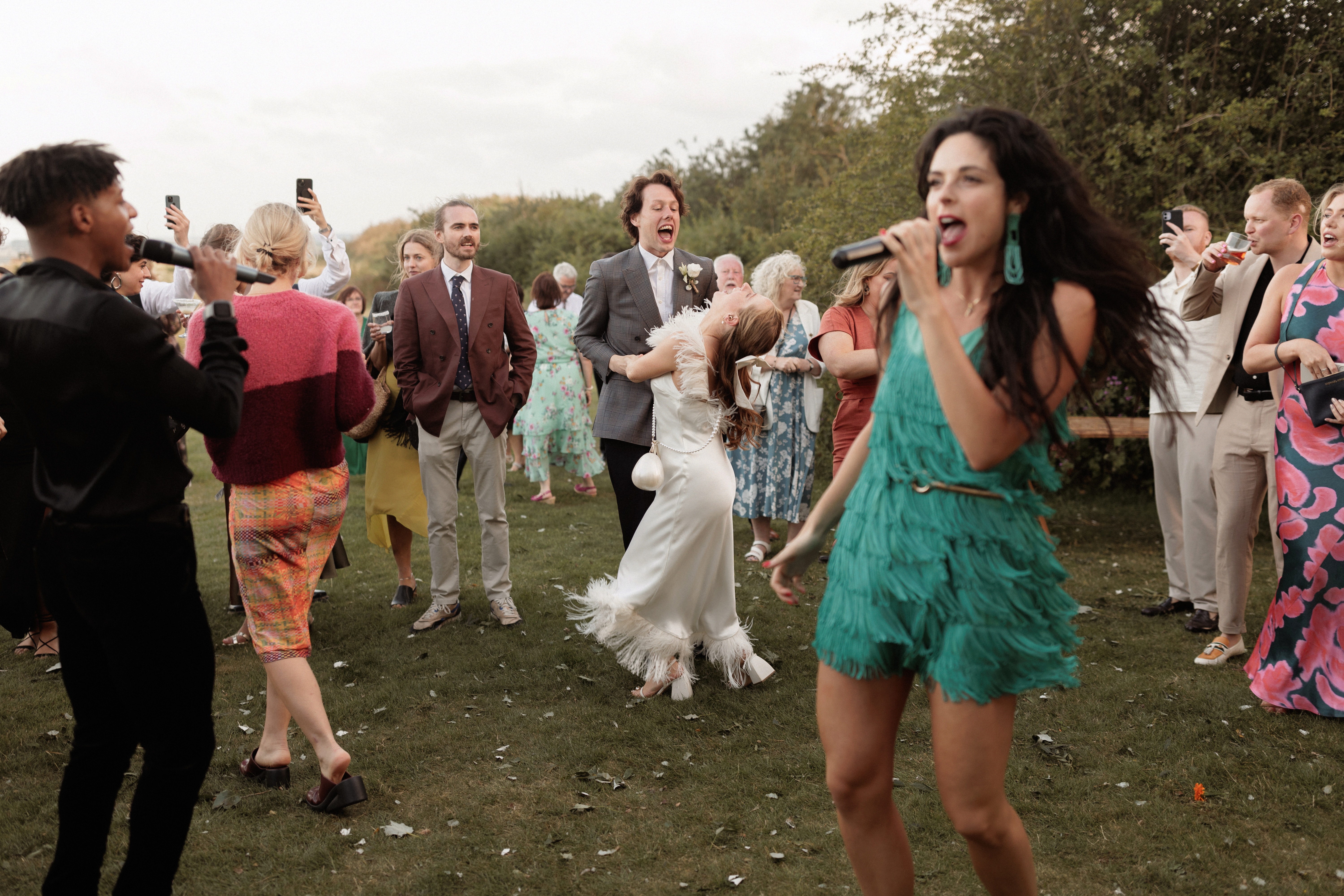 A Summer Wedding at Elmley Nature Reserve with Halfpenny London 109 Bride wearing chunky heels, a Halfpenny London dress and carrying the pearl egg bag by Simone Rocha. Elmley Nature Reserve wedding, Kent.