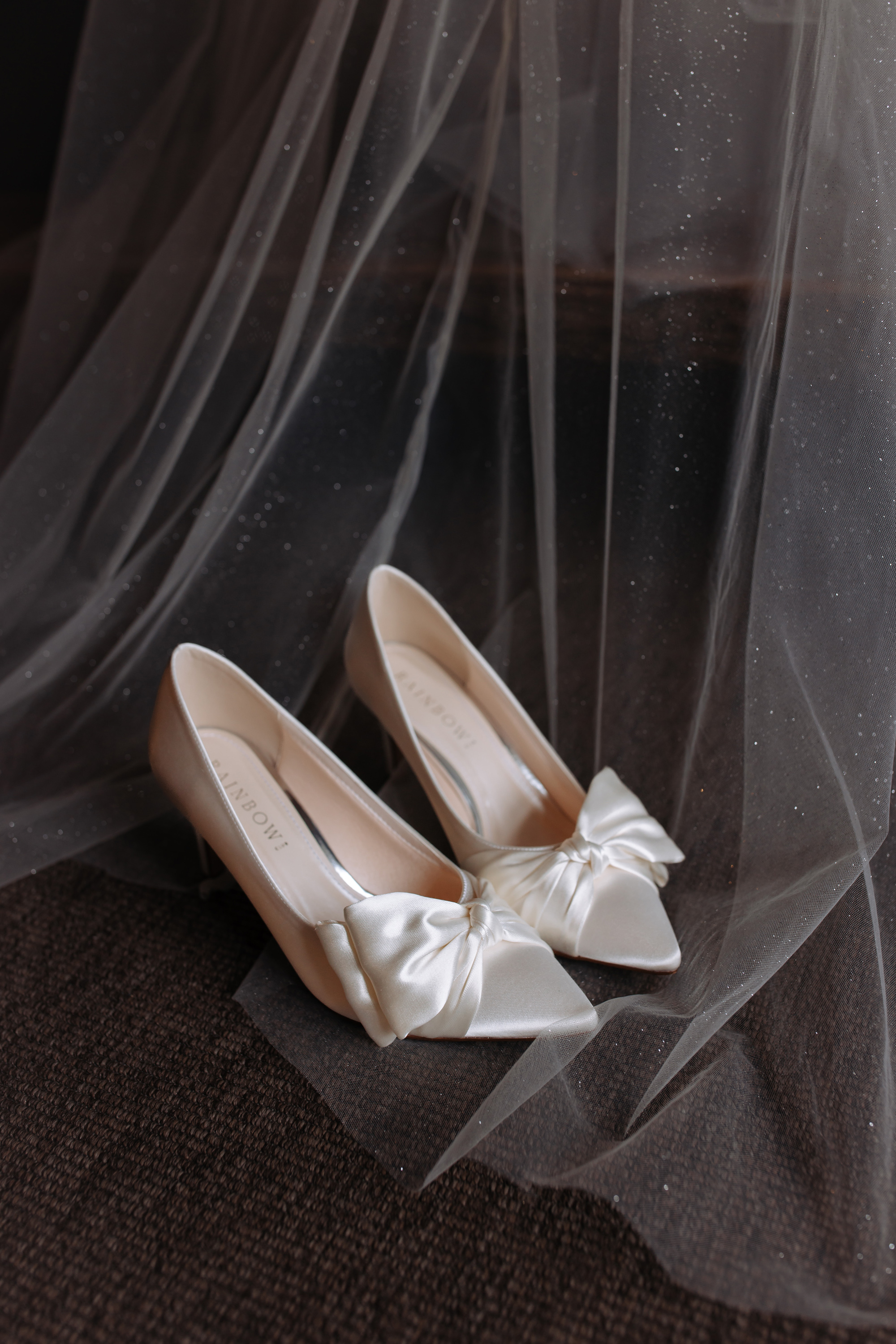 Rainbow Club wedding shoes with a bow.
