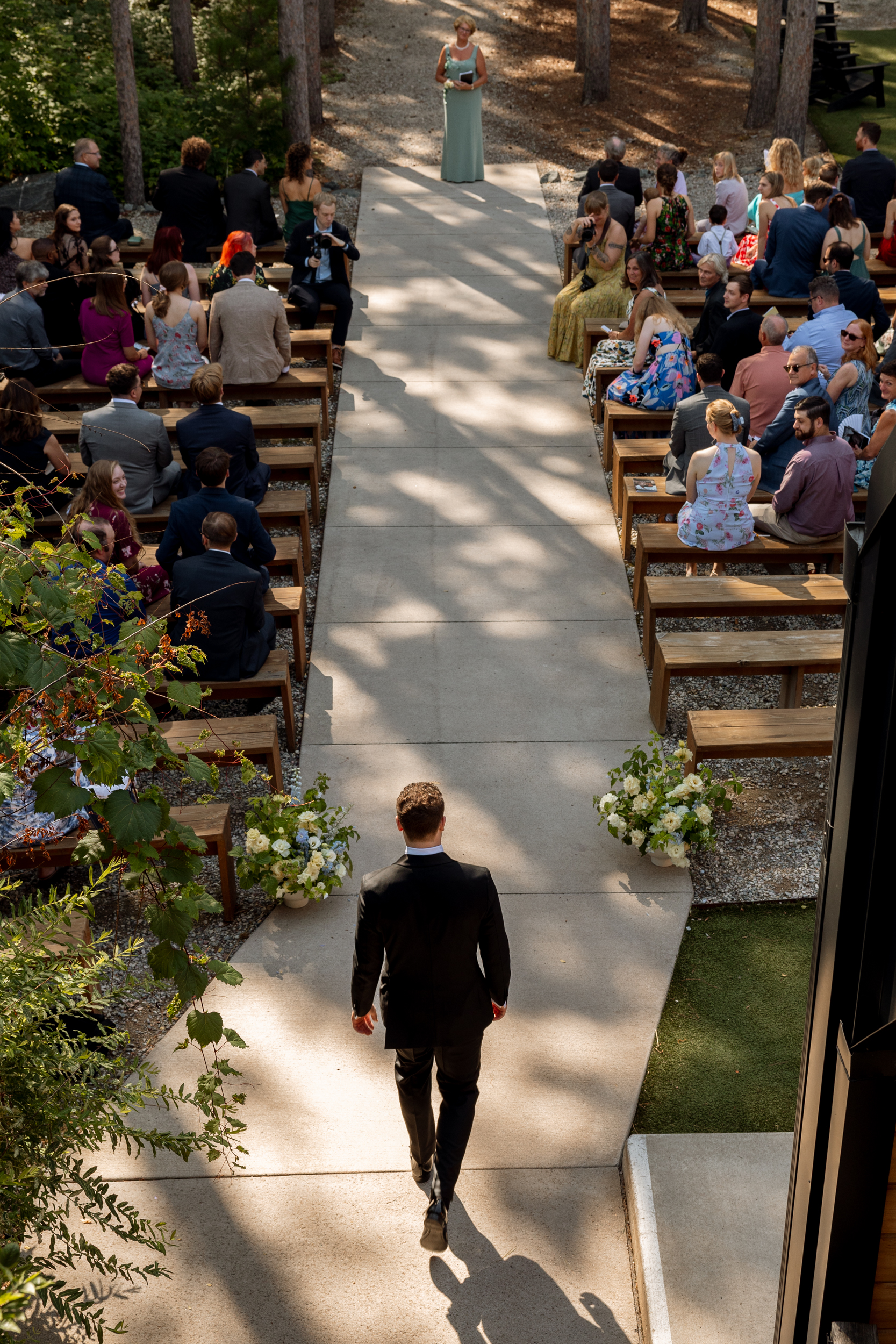 Vivienne Westwood bride Pinewood Weddings Events MA USA 48 - Emma Wore Vivienne Westwood for Her Joyful, Equality Inspired Summer Wedding Birds eye view of groom walking down the aisle at Pinewood Weddings & Events in MA, USA.