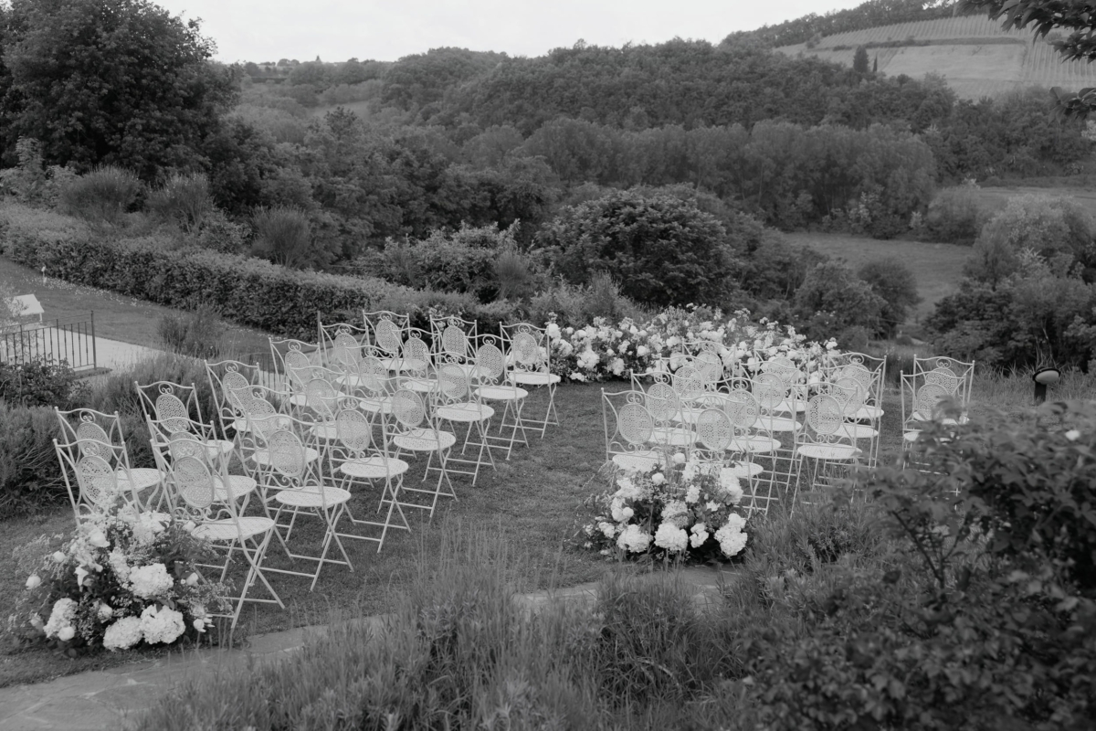 An Arakii Suit with Oversized Jacket for a Chic Italian Wedding at Antico Borgo 30 Elegant metal chairs laid out for an intimate outdoor wedding ceremony at Antico Borgo San Lorenzo in Poggibonsi, Italy. Destination wedding.