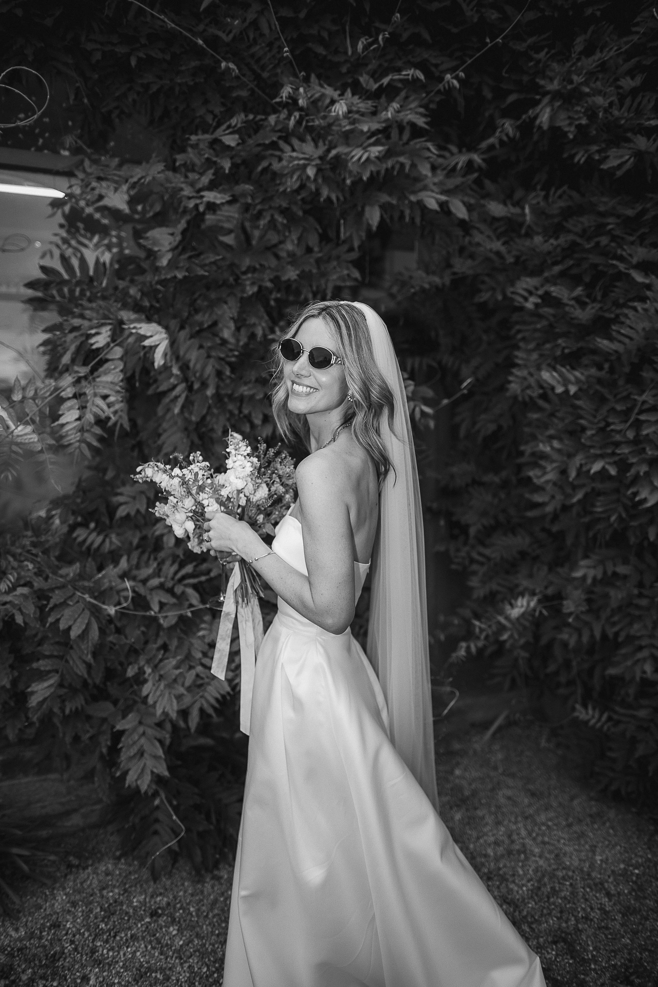 Boconnoc Estate Wedding Cornwall Jesus Peiro 111 1 - Lauren in Jesus Peiro for her Elegant Boconnoc Estate Wedding in Cornwall Black and white photograph of a bride wearing sunglasses with her Jesus Peiro wedding dress.