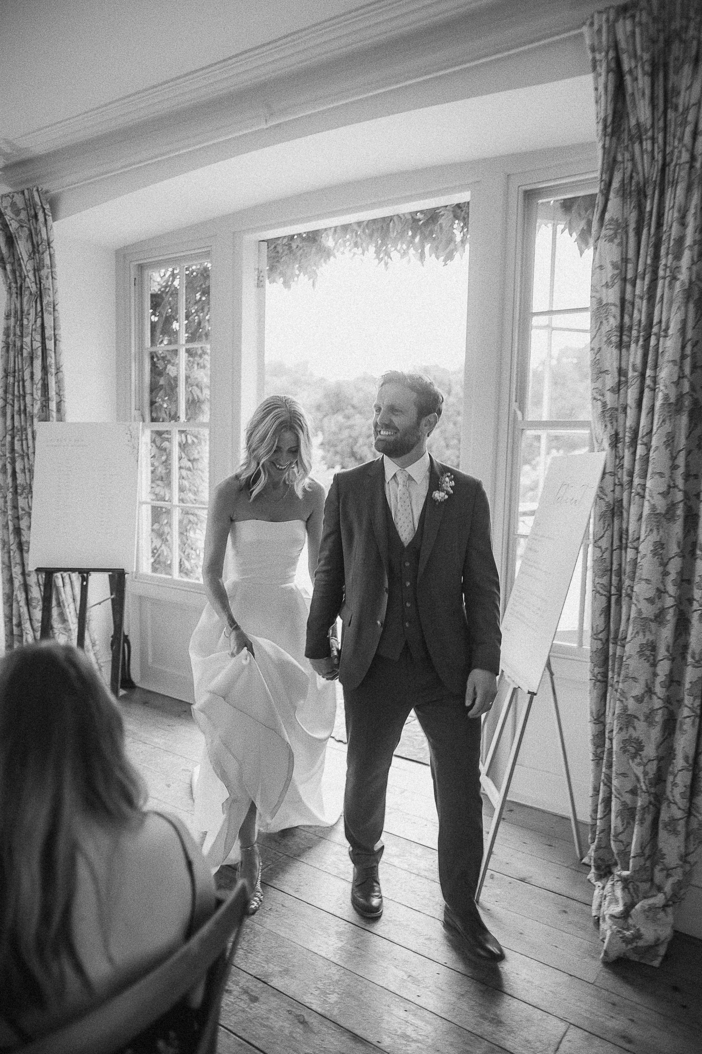 Boconnoc Estate Wedding Cornwall Jesus Peiro 146 - Lauren in Jesus Peiro for her Elegant Boconnoc Estate Wedding in Cornwall Joyful bride and groom arrive at their wedding reception at Boconnoc Estate.