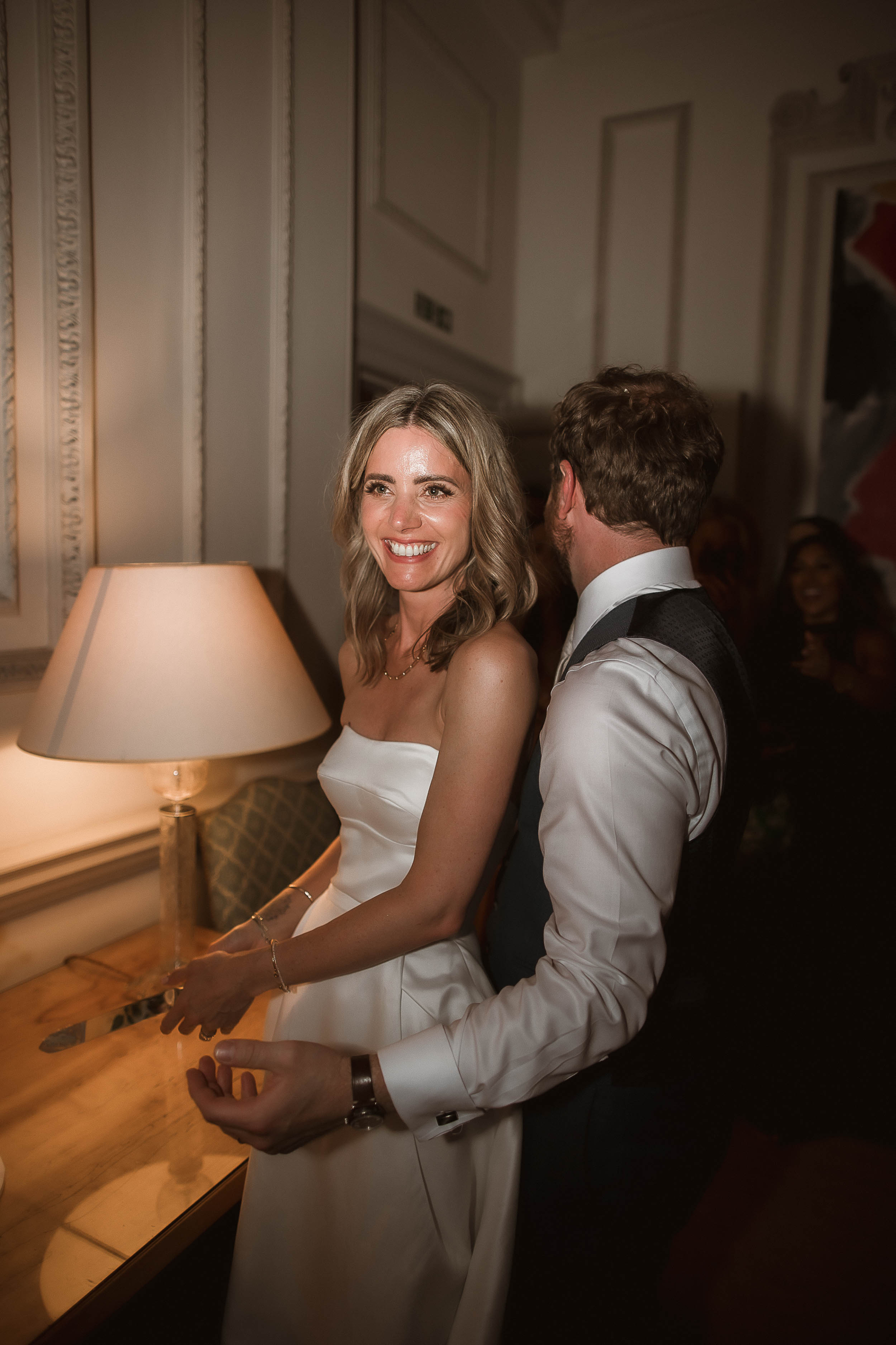 Boconnoc Estate Wedding Cornwall Jesus Peiro 175 - Lauren in Jesus Peiro for her Elegant Boconnoc Estate Wedding in Cornwall Happy bride in a Jesus Peiro dress being hugged by her groom.