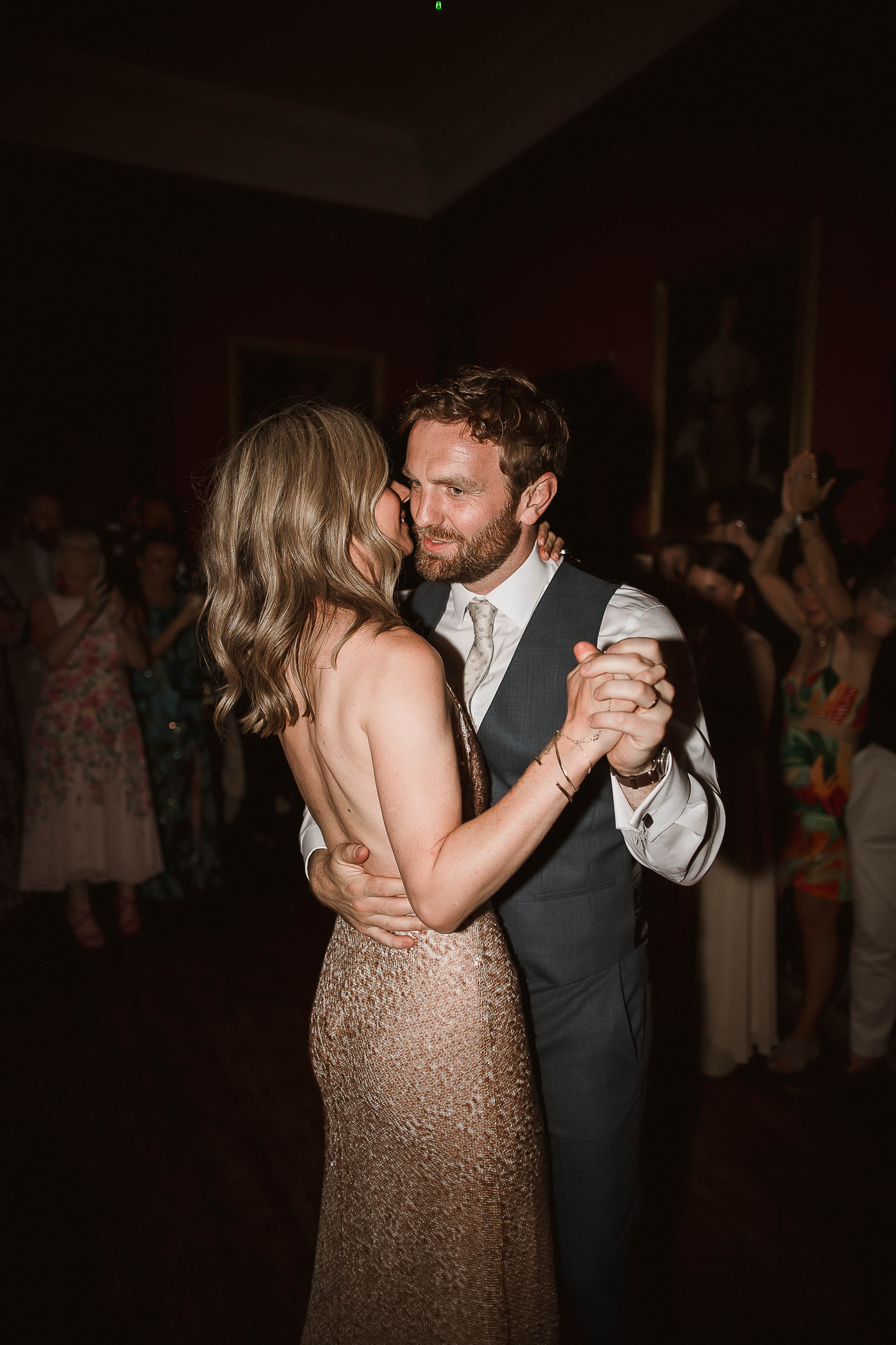 Boconnoc Estate Wedding Cornwall Jesus Peiro 182 - Lauren in Jesus Peiro for her Elegant Boconnoc Estate Wedding in Cornwall Bride and groom embracing during a dance. She is wearing a backless sequinned gold dress.