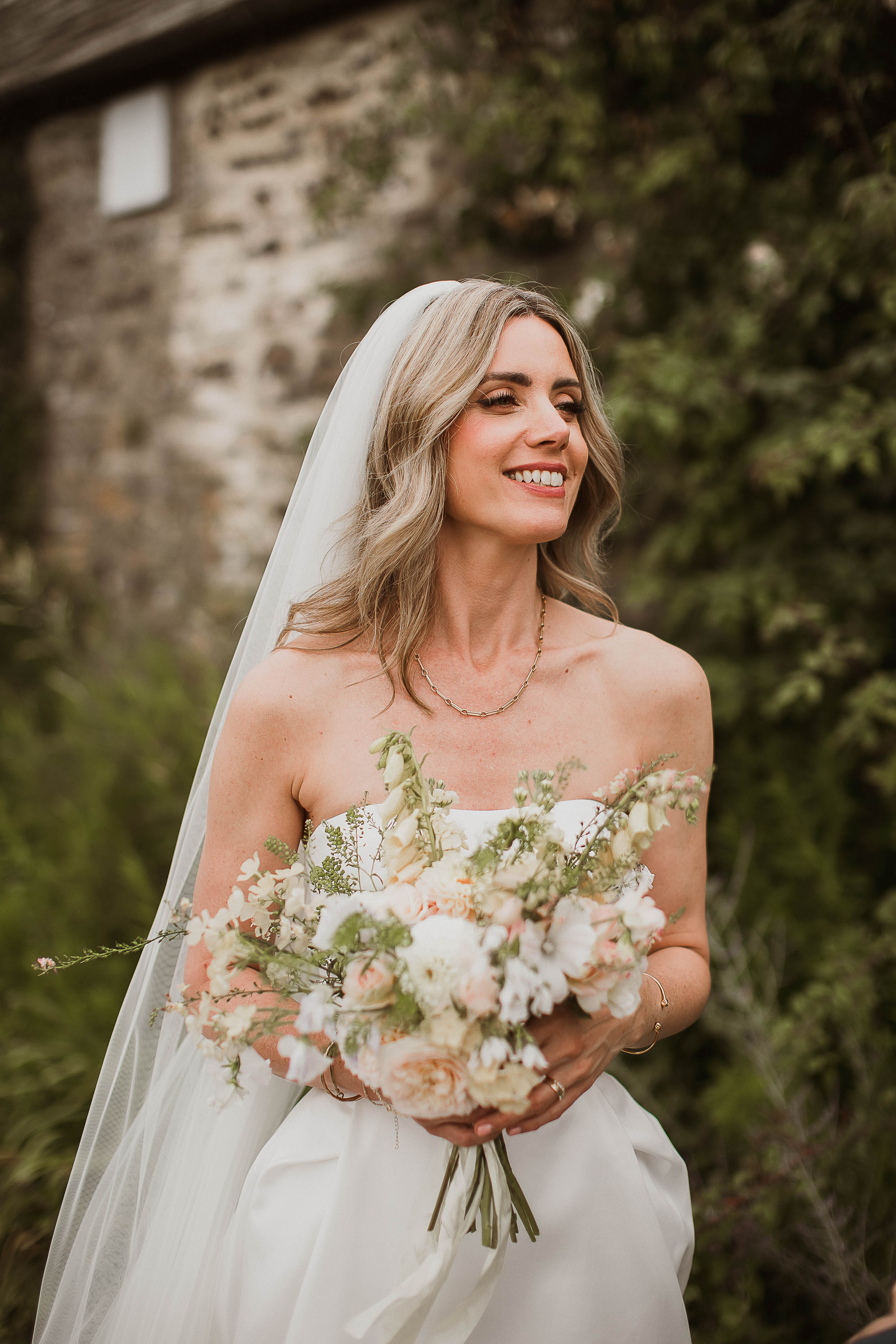 Boconnoc Estate Wedding Cornwall Jesus Peiro 79 - Lauren in Jesus Peiro for her Elegant Boconnoc Estate Wedding in Cornwall Bride in a strapless Jesus Peiro wedding dress holding a