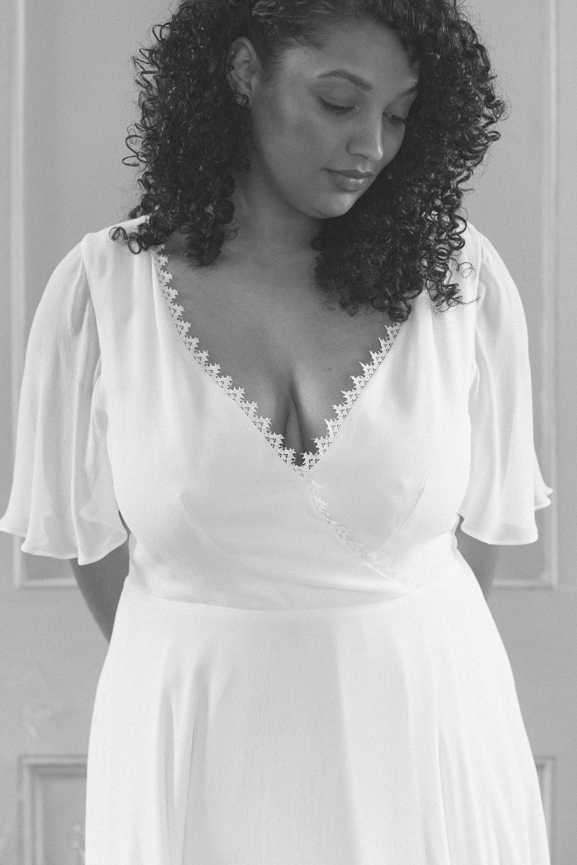 Chrysanthemum silk wedding gown KateBeaumont Icons 1 IndiaHobson HR 146 - Kate Beaumont: Lovingly Handmade Silk Wedding Dresses Black curvy bride with loose curly hair wearing a Kate Beaumont wedding dress.