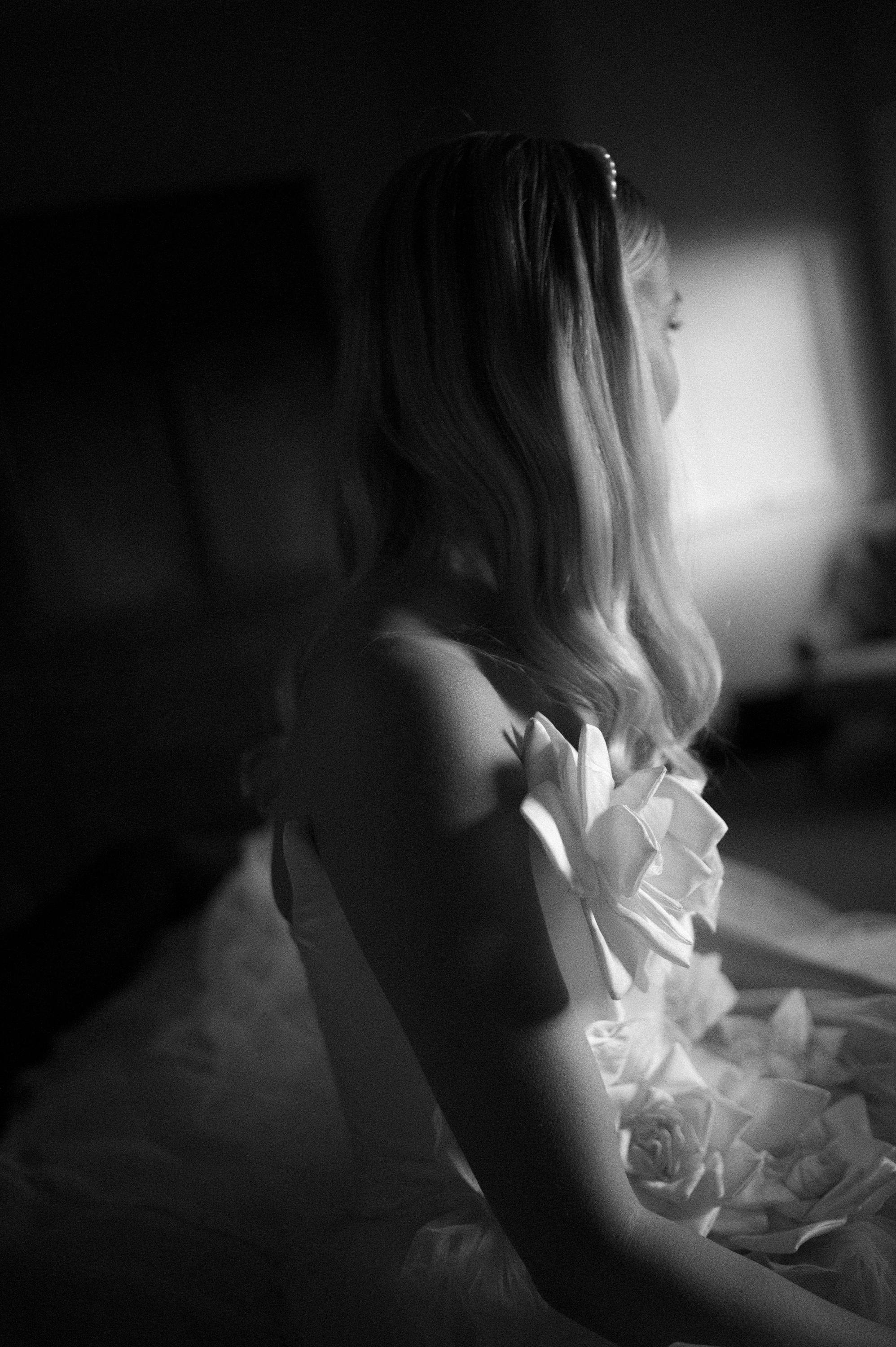 Earnshill House Wedding Editorial Fern Godfrey Weddings 47 1 - Modern Bridal Elegance at Earnshill House, A Romantic Somerset Wedding Venue Black and white close up shot of bride wearing a JULITA dress with 3D silk roses.