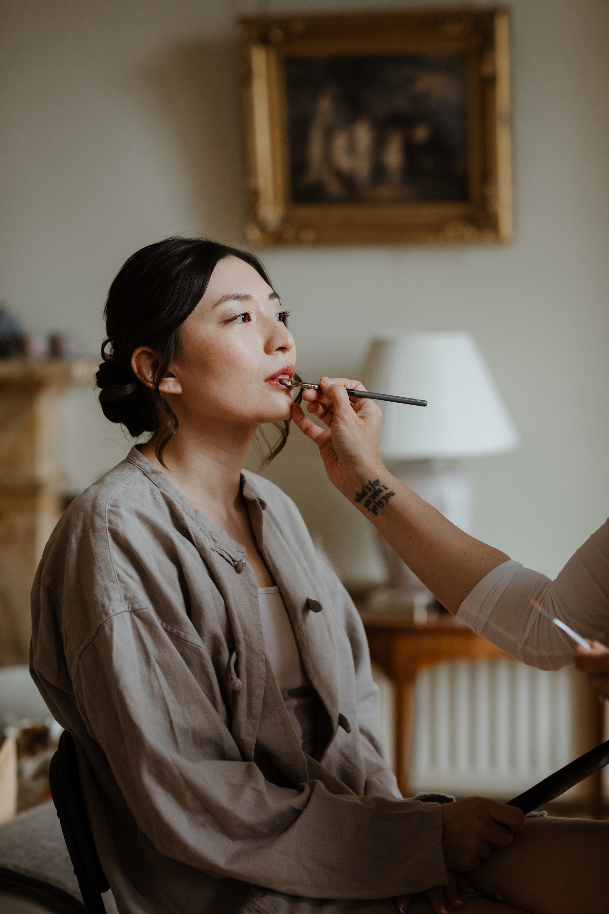 Asian bride having her makeup applied by Heather Snowie, wedding hair and makeup artist.