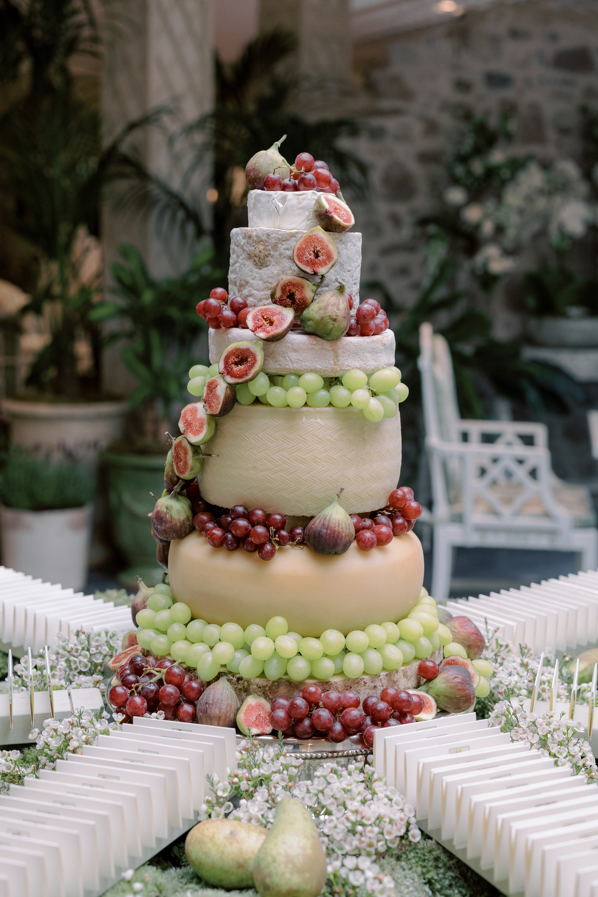 Wedding cheesecake with figs, red grapes and green grapes.