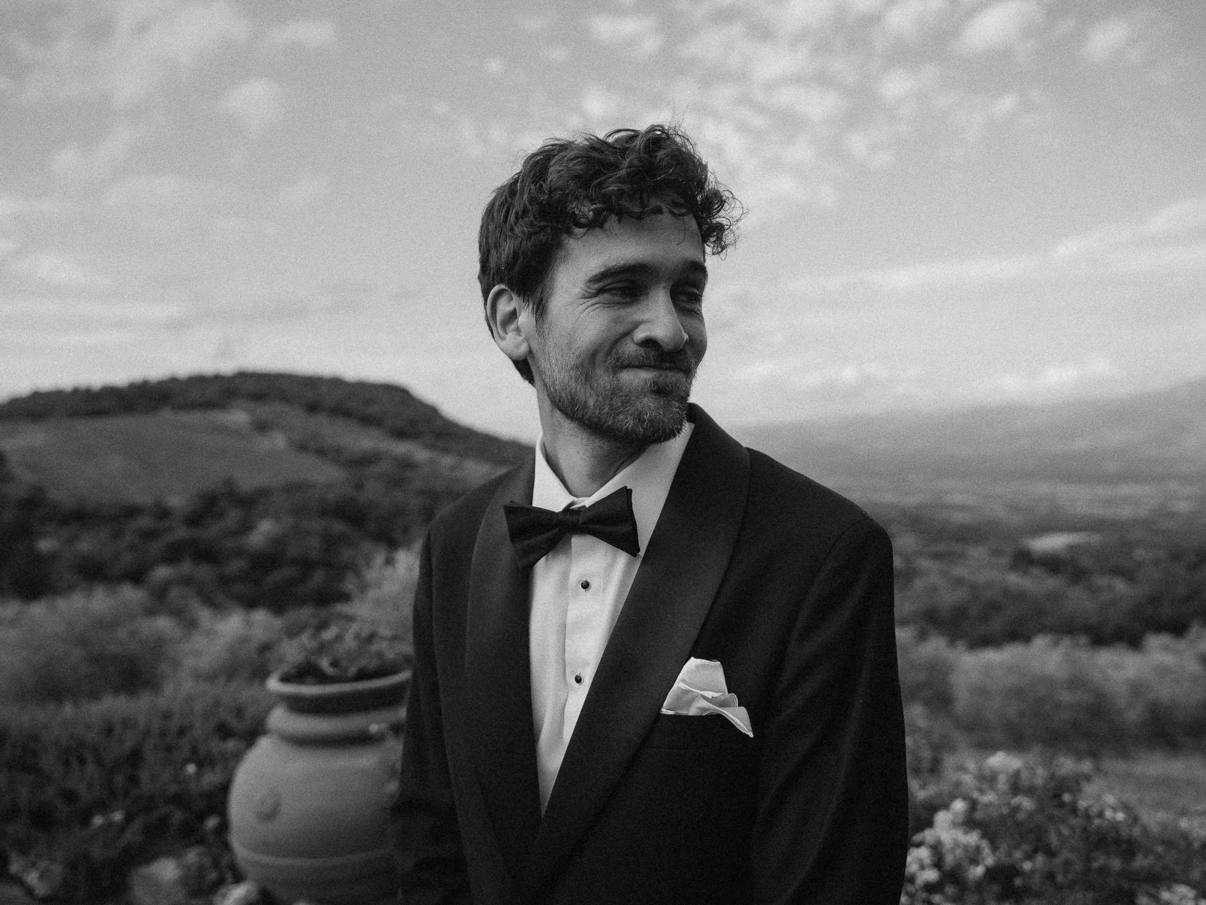 Romantic Tuscan Elopement on Film 108 - An Original 1940s Vintage Dress for Emily & Ned's Intimate Elopement in Tuscany Emotional groom in black tie turning to see his bride for the first time.