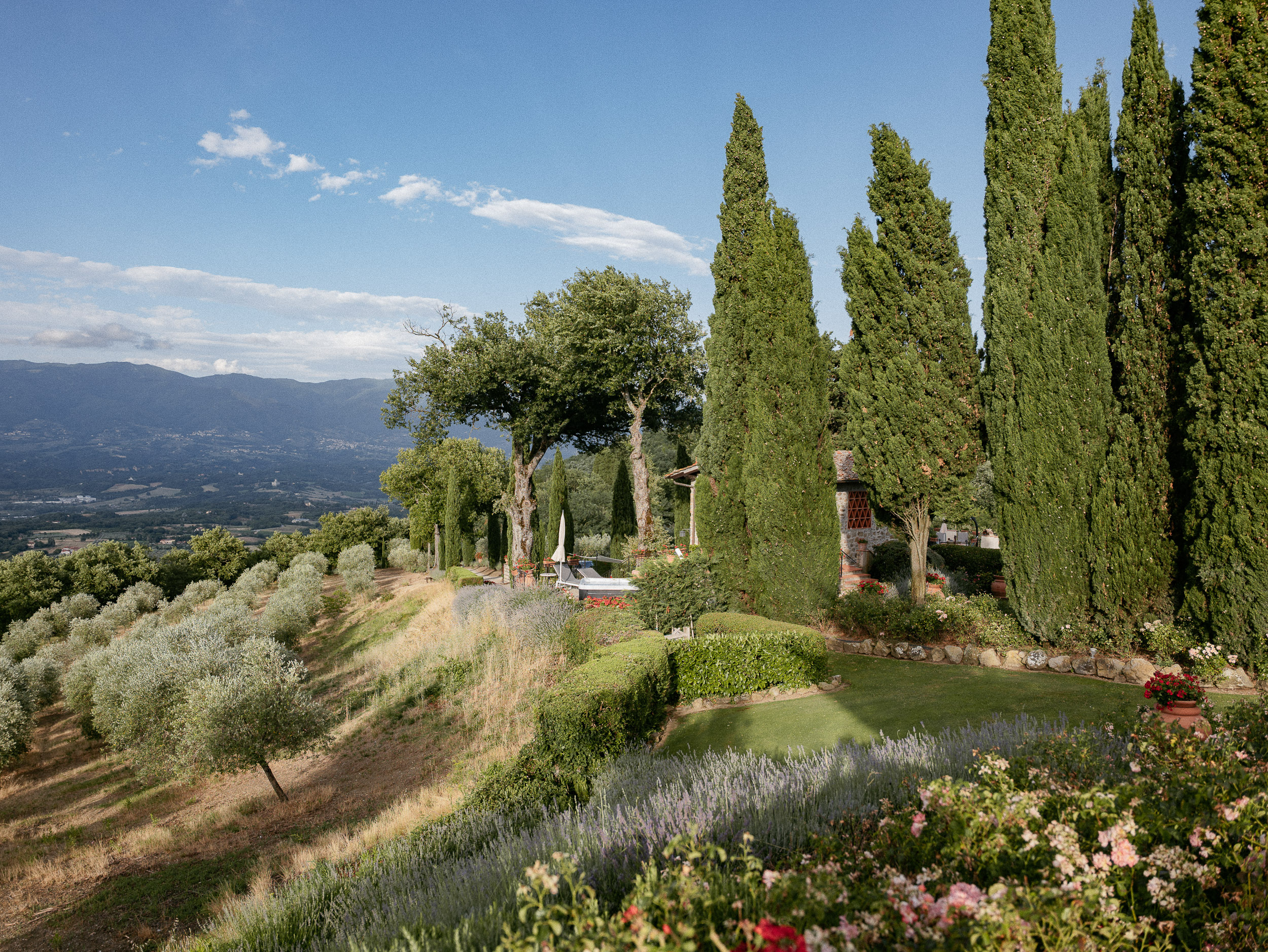 Romantic Tuscan Elopement on Film 213 - An Original 1940s Vintage Dress for Emily & Ned's Intimate Elopement in Tuscany Tall evergreen trees at a Tuscan villa.