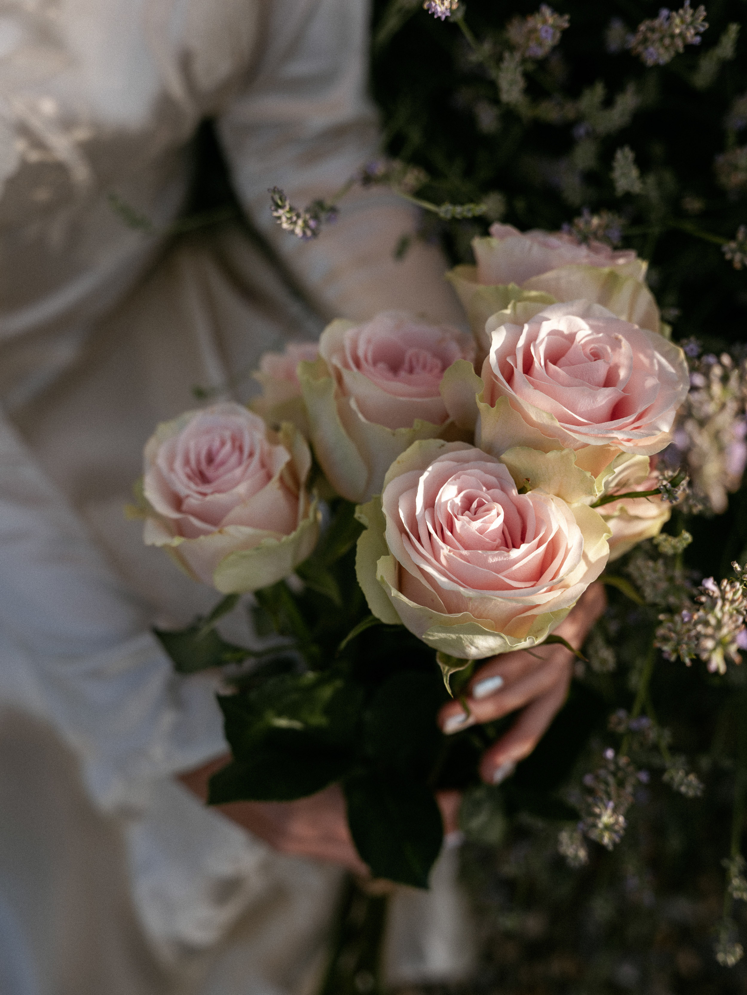 Romantic Tuscan Elopement on Film 232 - An Original 1940s Vintage Dress for Emily & Ned's Intimate Elopement in Tuscany Bouquet of pale pink roses being held by a bride wearing a vintage 1940's wedding dress.