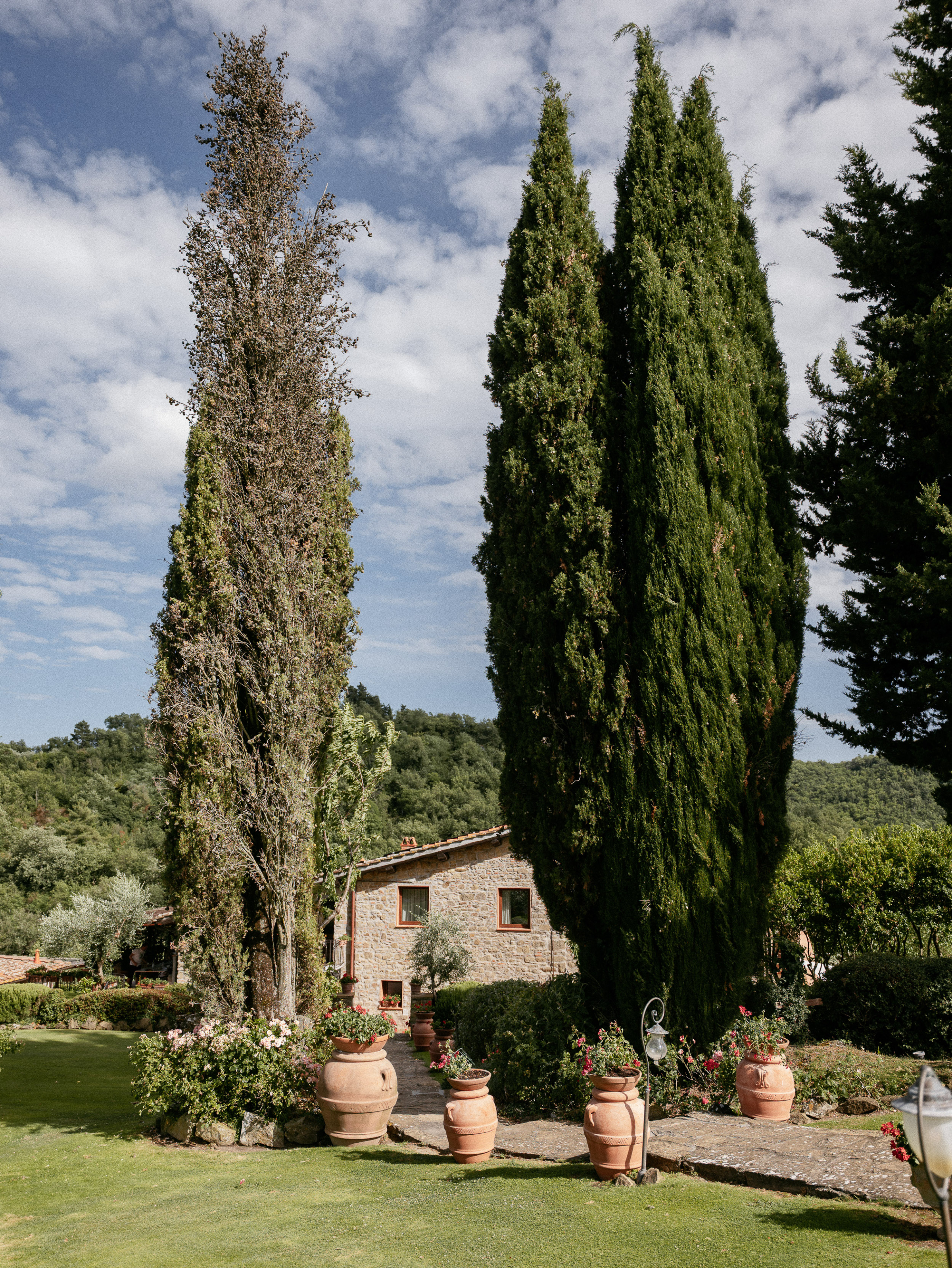 Romantic Tuscan Elopement on Film 26 - An Original 1940s Vintage Dress for Emily & Ned's Intimate Elopement in Tuscany Tall evergreen trees at a Tuscan villa.