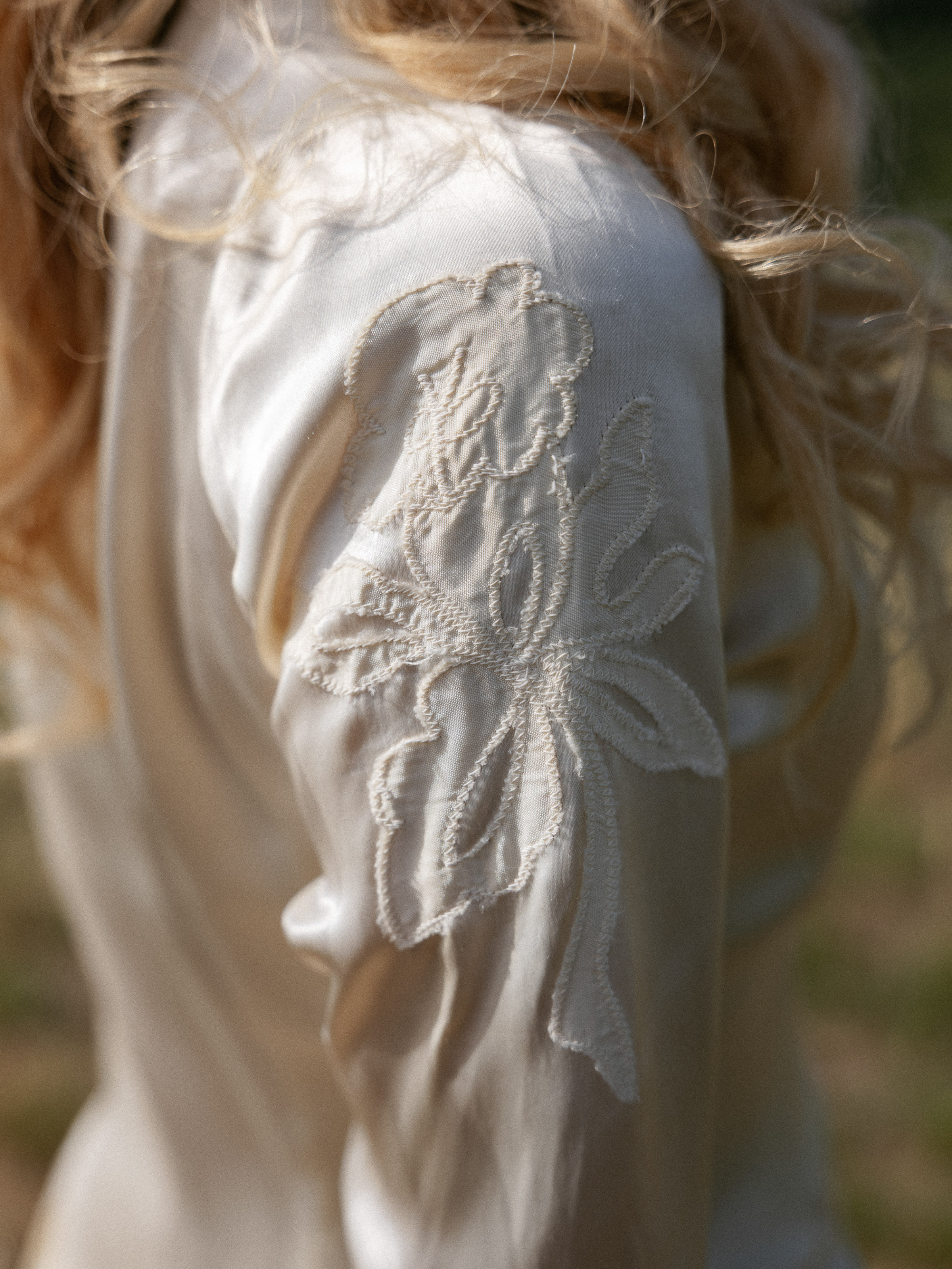 Romantic Tuscan Elopement on Film 67 1 - An Original 1940s Vintage Dress for Emily & Ned's Intimate Elopement in Tuscany Shoulder of a 1940's original vintage wedding dress.