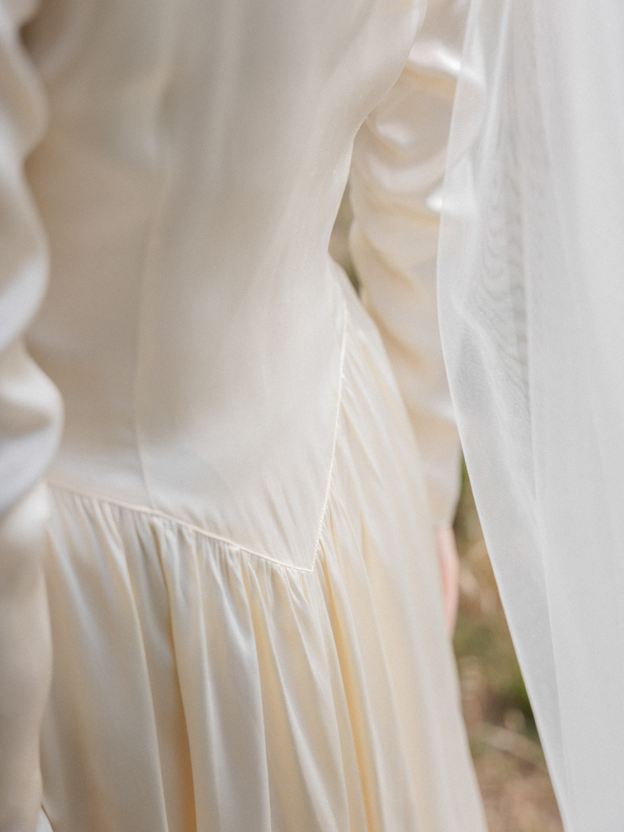 Romantic Tuscan Elopement on Film 69 - An Original 1940s Vintage Dress for Emily & Ned's Intimate Elopement in Tuscany Close up of the bodice from behind on a 1940's vintage silk wedding dress with long sleeves.