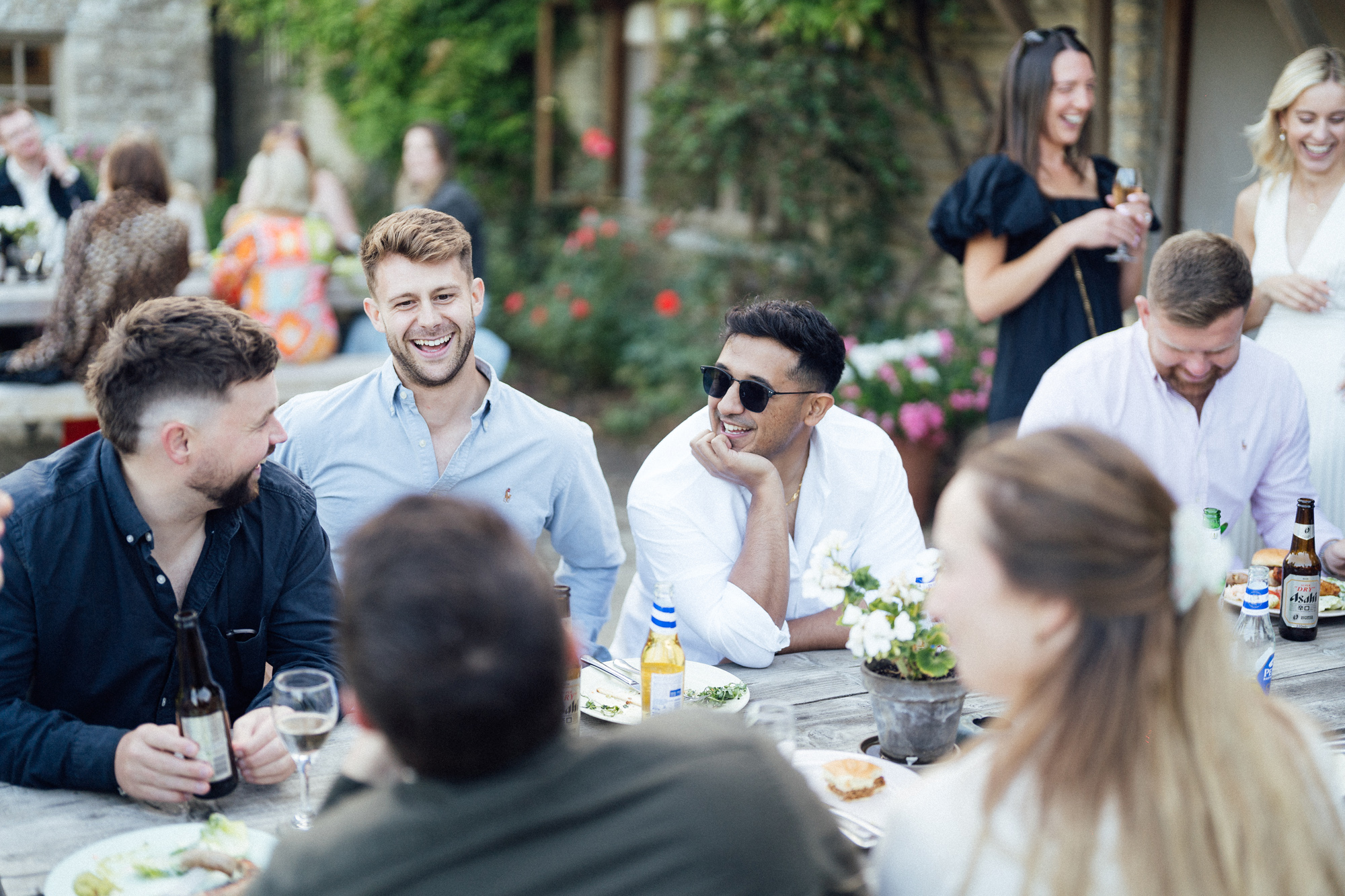 The New Wedding Aesthetic: A Sense of Home 32 Wedding guests relaxed and enjoying a drink at Tythe, Oxfordshire barn wedding venue.