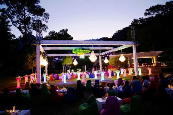 Outdoor wedding after party with LED cocktail tables bean bag seating and chandeliers at venue in Antalya Turkey by Ramarossi