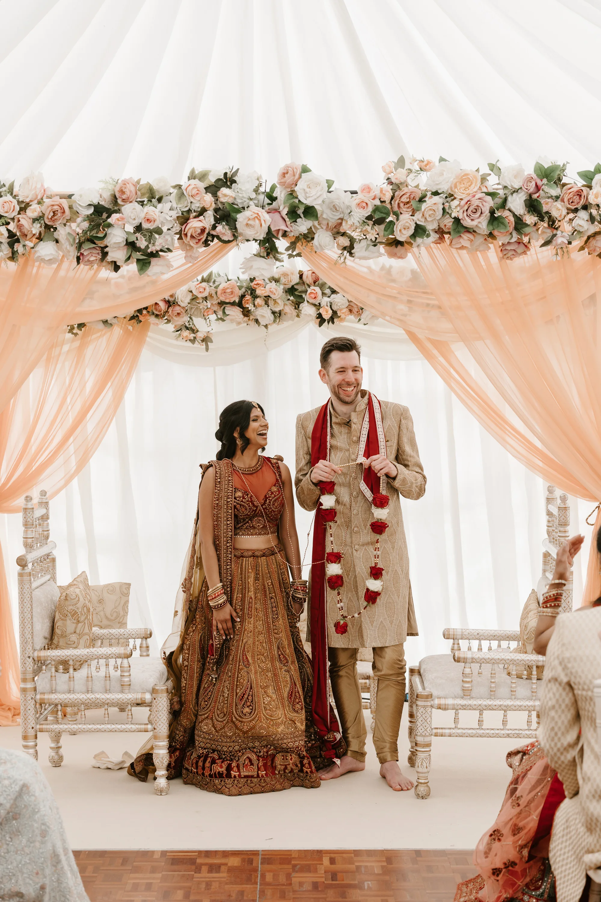 Fusion HIndu Wedding Newburgh Priory 26 - Hema & Will's Fusion Wedding & Hindu Ceremony at Newburgh Priory Hindu wedding ceremony taking place beneath a mandap decorated with peach tulle and peach flowers.