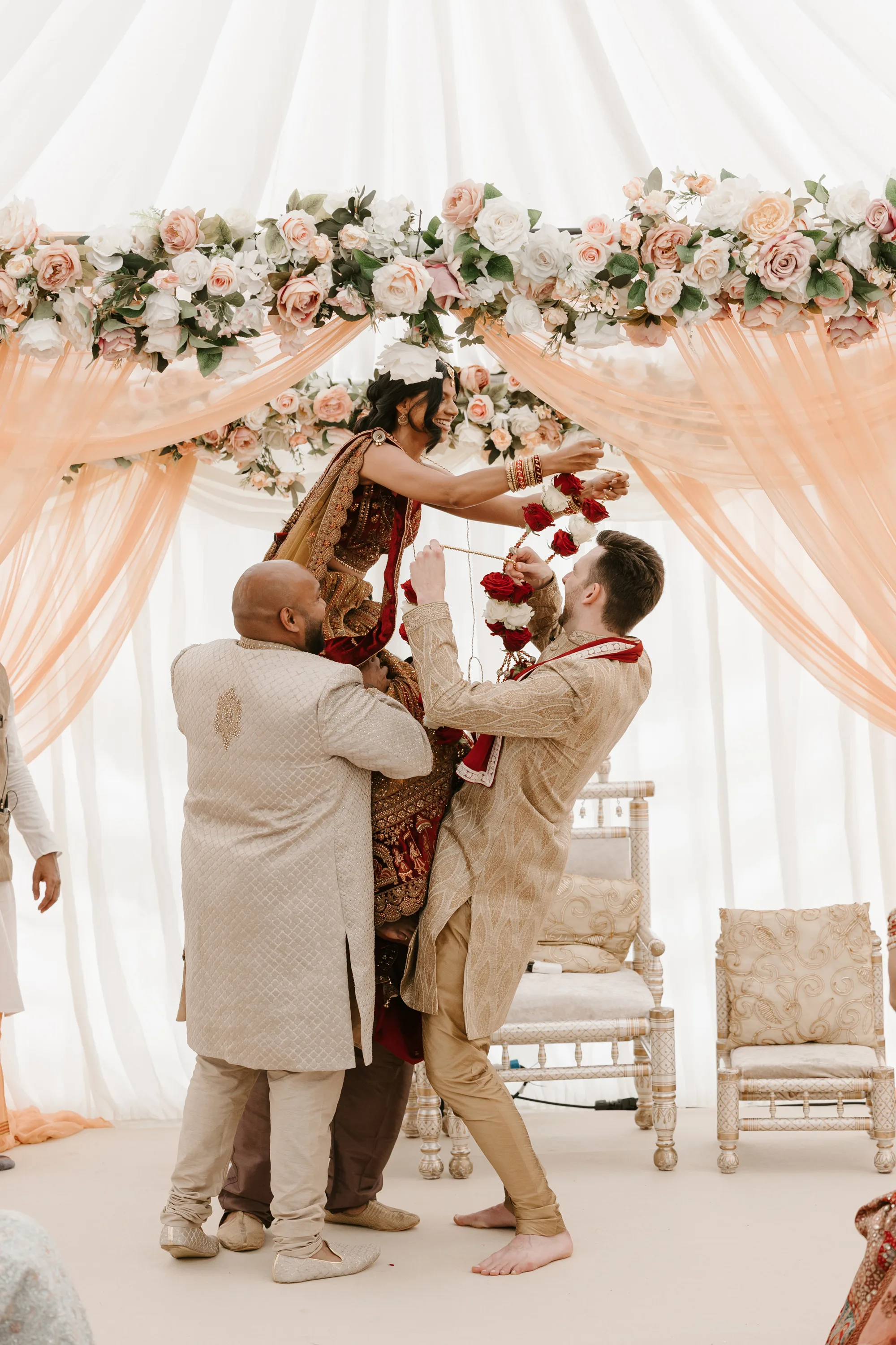 Fusion HIndu Wedding Newburgh Priory 27 - Hema & Will's Fusion Wedding & Hindu Ceremony at Newburgh Priory Hindu wedding ceremony taking place beneath a mandap decorated with peach tulle and peach flowers.