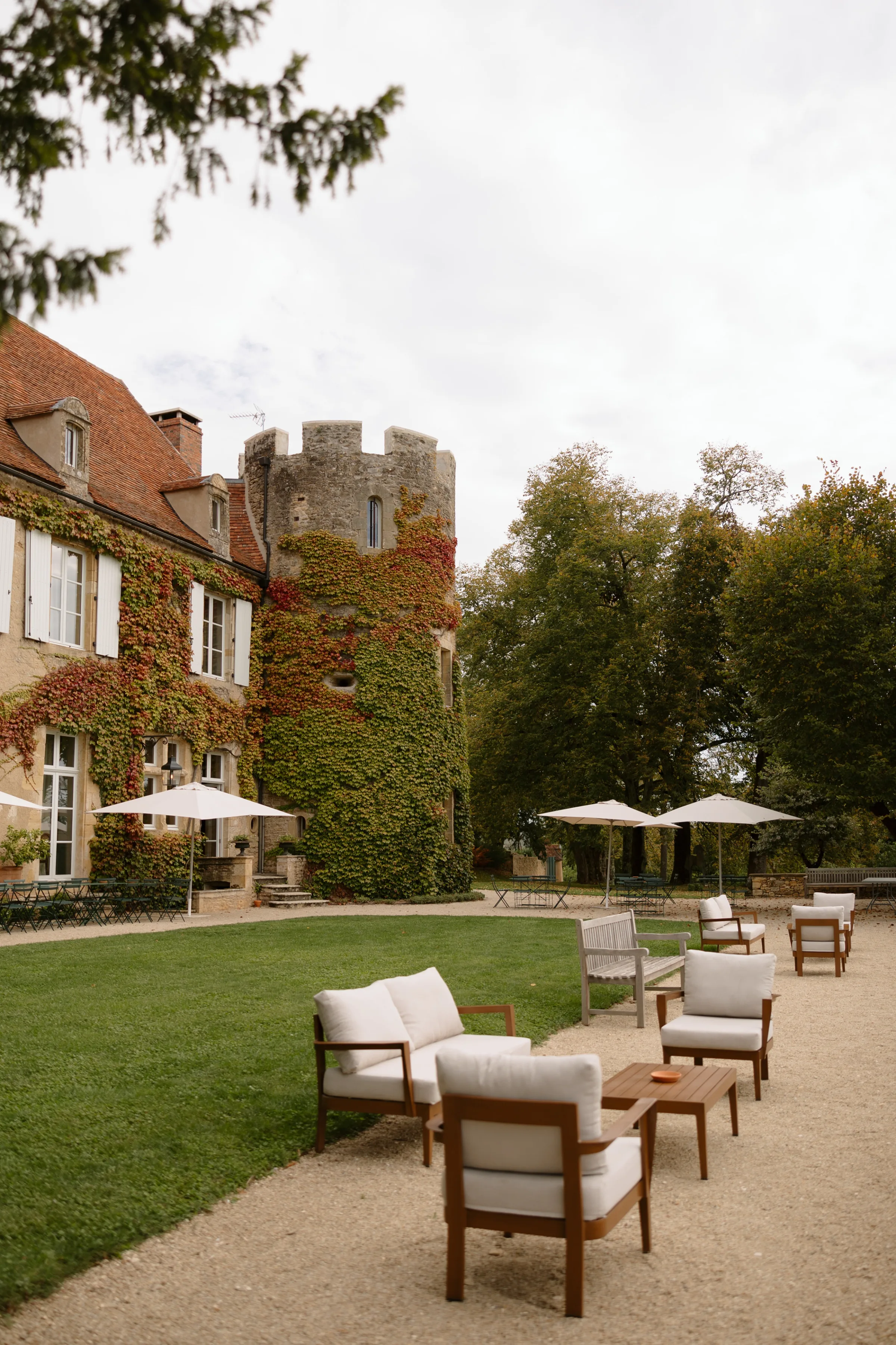 Indie Bride London Chateau Cazenac wedding France 1 - Laura & Ben's Romantic & Intimate Wedding Day Gathering at Chateau Cazenac in The Dordogne Relaxed outdoor guest seating in the grounds of Chateau Cazenac, a wedding venue in Dordogne, France.