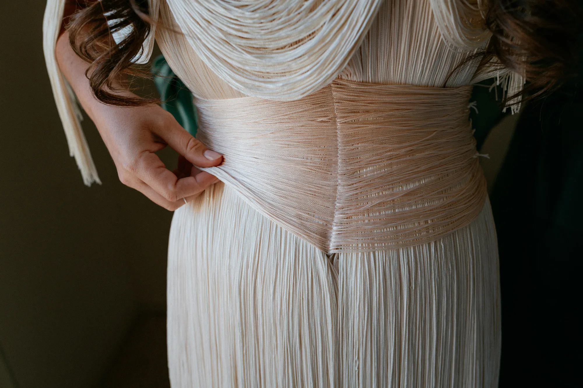 Multiple Day Destination Wedding in Masseria Potenti Puglia Italy 16 - Yael Wore Chana Marelus & A Handmade Beaded Veil for her Relaxed Italian Masseria Wedding Close up shot of a Chana Marelus dress with tassels.