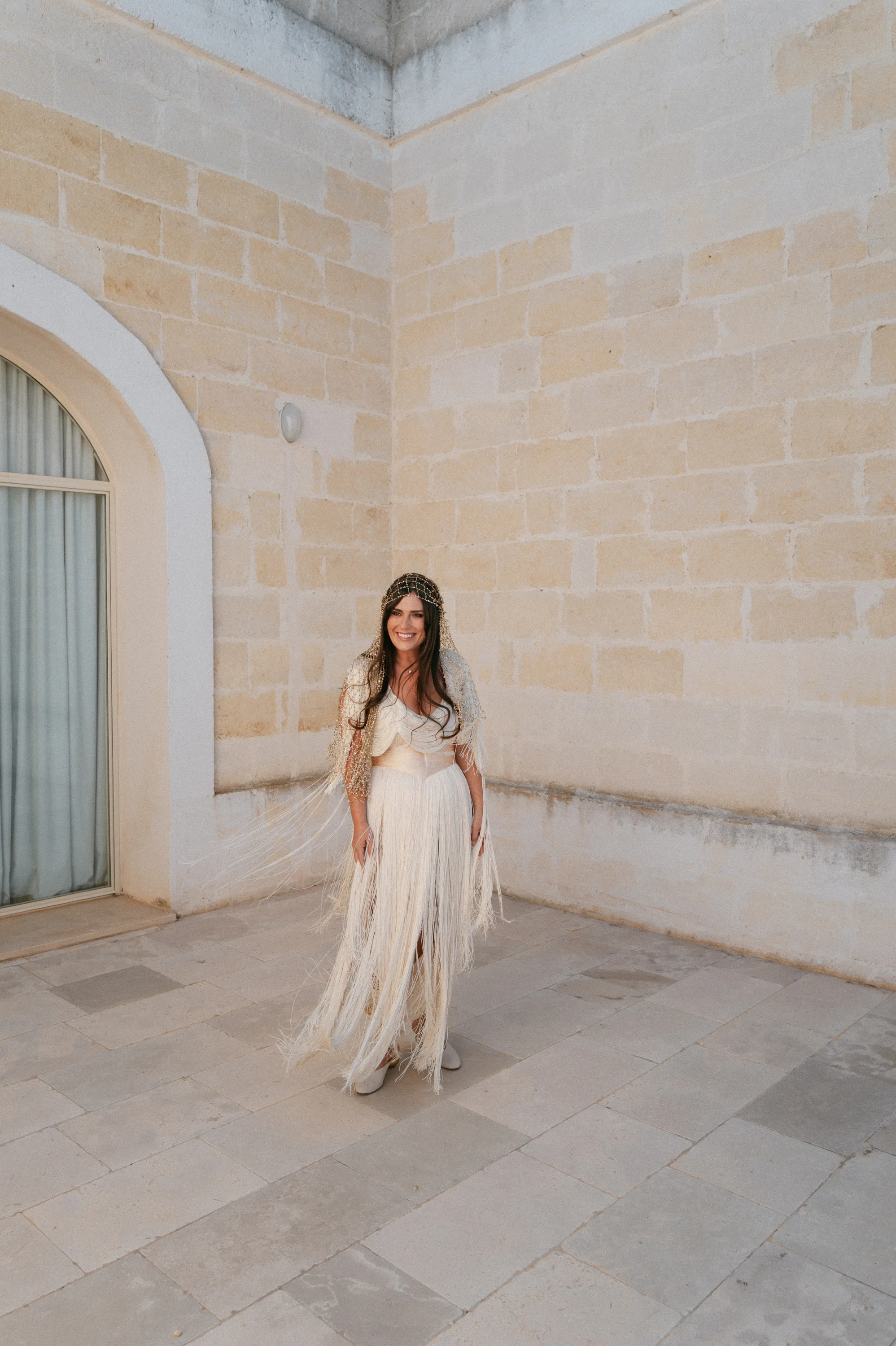 Multiple Day Destination Wedding in Masseria Potenti Puglia Italy 18 - Yael Wore Chana Marelus & A Handmade Beaded Veil for her Relaxed Italian Masseria Wedding Bride wearing a Chana Marelus with tassels and a beaded veil.