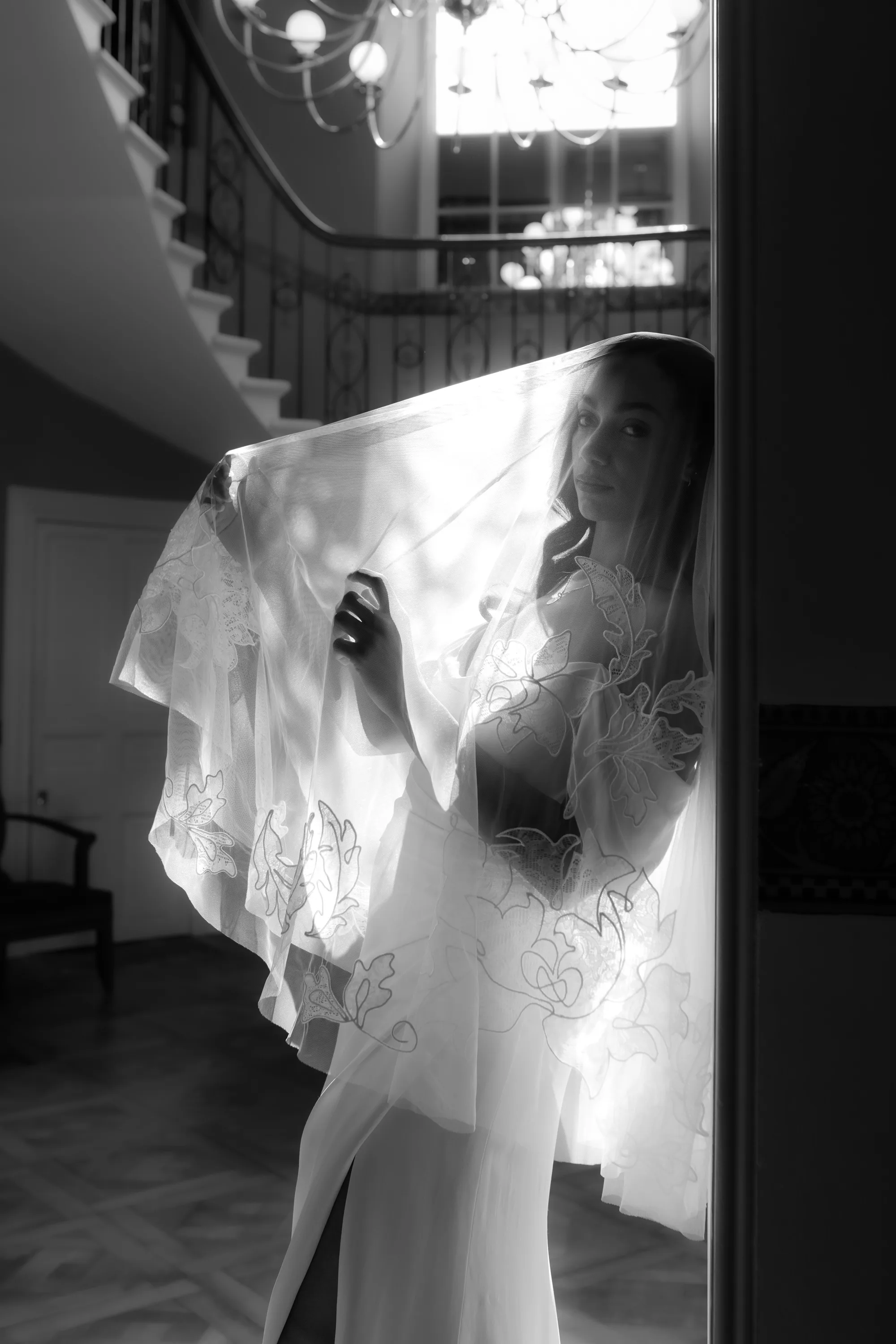 Rebecca Anne Designs embroidered wedding veils 50 - Introducing the New Embroidered Wedding Veil & Bridal Accessories Collection by Rebecca Anne Designs Sensuous black and white shot of a model leaning back against a wall, natural light floods through her embroidered wedding veil by Rebecca Anne Designs.