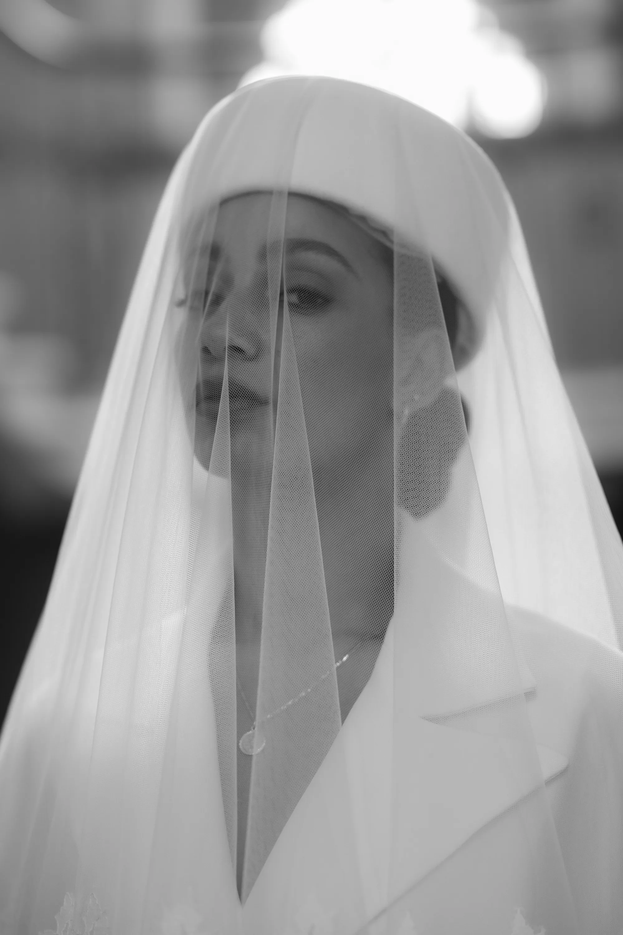 Rebecca Anne Designs embroidered wedding veils 75 1 - Introducing the New Embroidered Wedding Veil & Bridal Accessories Collection by Rebecca Anne Designs Model bride in a pillbox hat with a veil by Rebecca Anne Designs, elegantly draped over the top and falling down over her face.