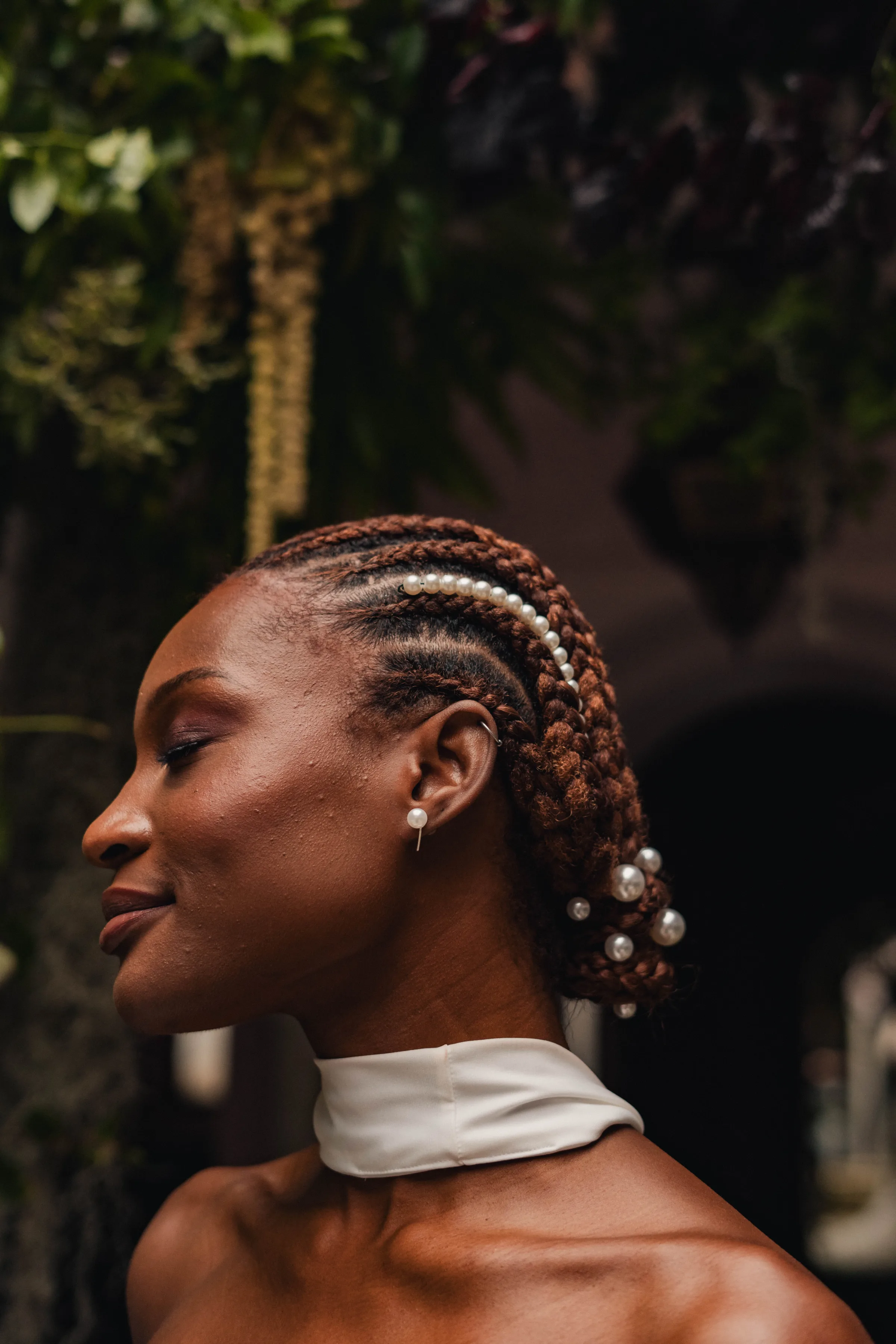 SS Port Lympne Safari Park New Orleans Wedding Editorial The Chamberlins Film Medium Format Photography London Surrey 264 - Wedding Inspiration That Celebrates The Joy, Diversity & Vibrancy of New Orleans Profile shot of the face of a beautiful Black model bride with pearl in her braided afro hair.